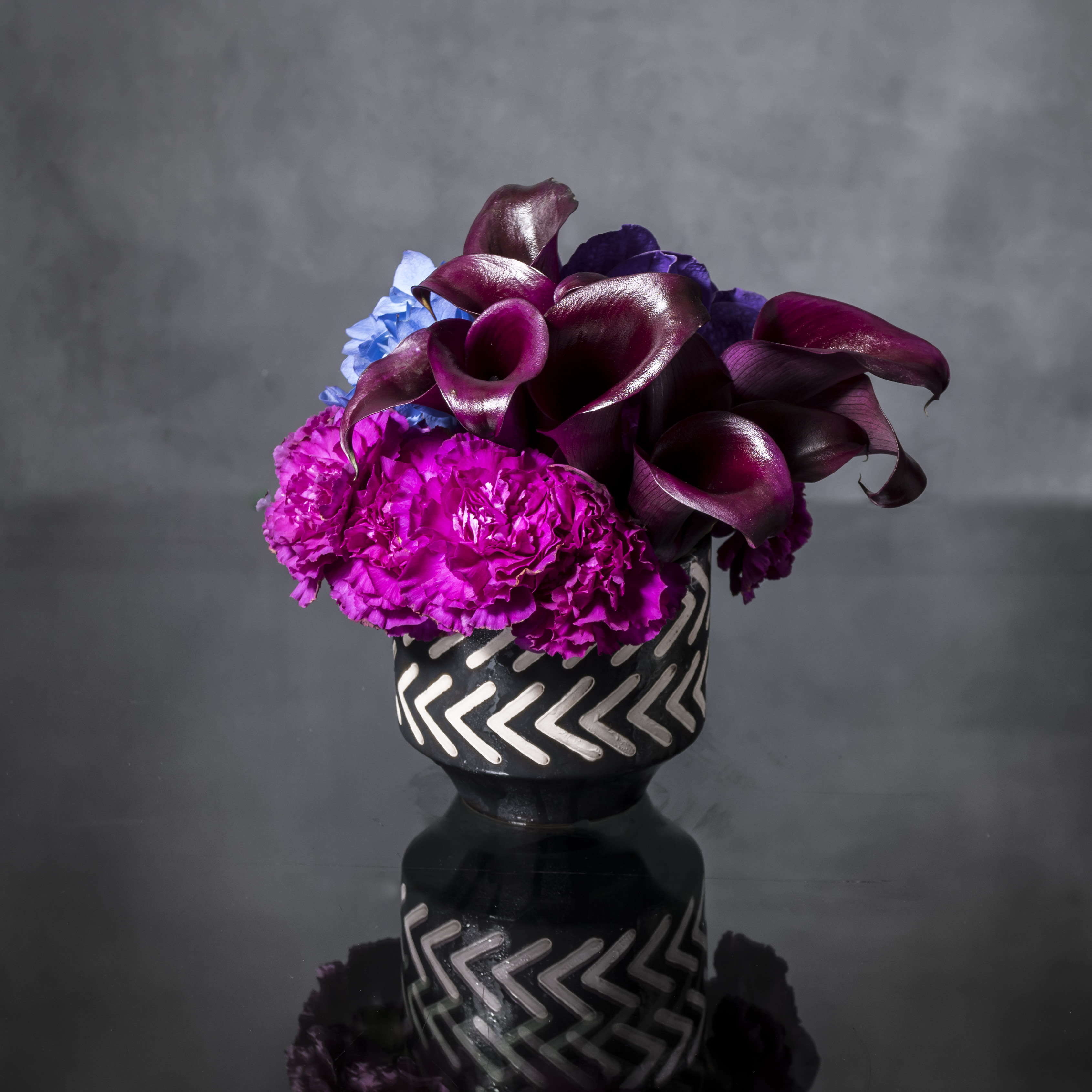 Blue Moonlight - Pasadena Florist - Oooo-la-la! Lavish and lovely, this assortment of specialty florals in shade of blues, purples, and pinks, with the perfect mixture of delicate textures and color waves make this an unforgettably chic and charming gift for any occasion.  