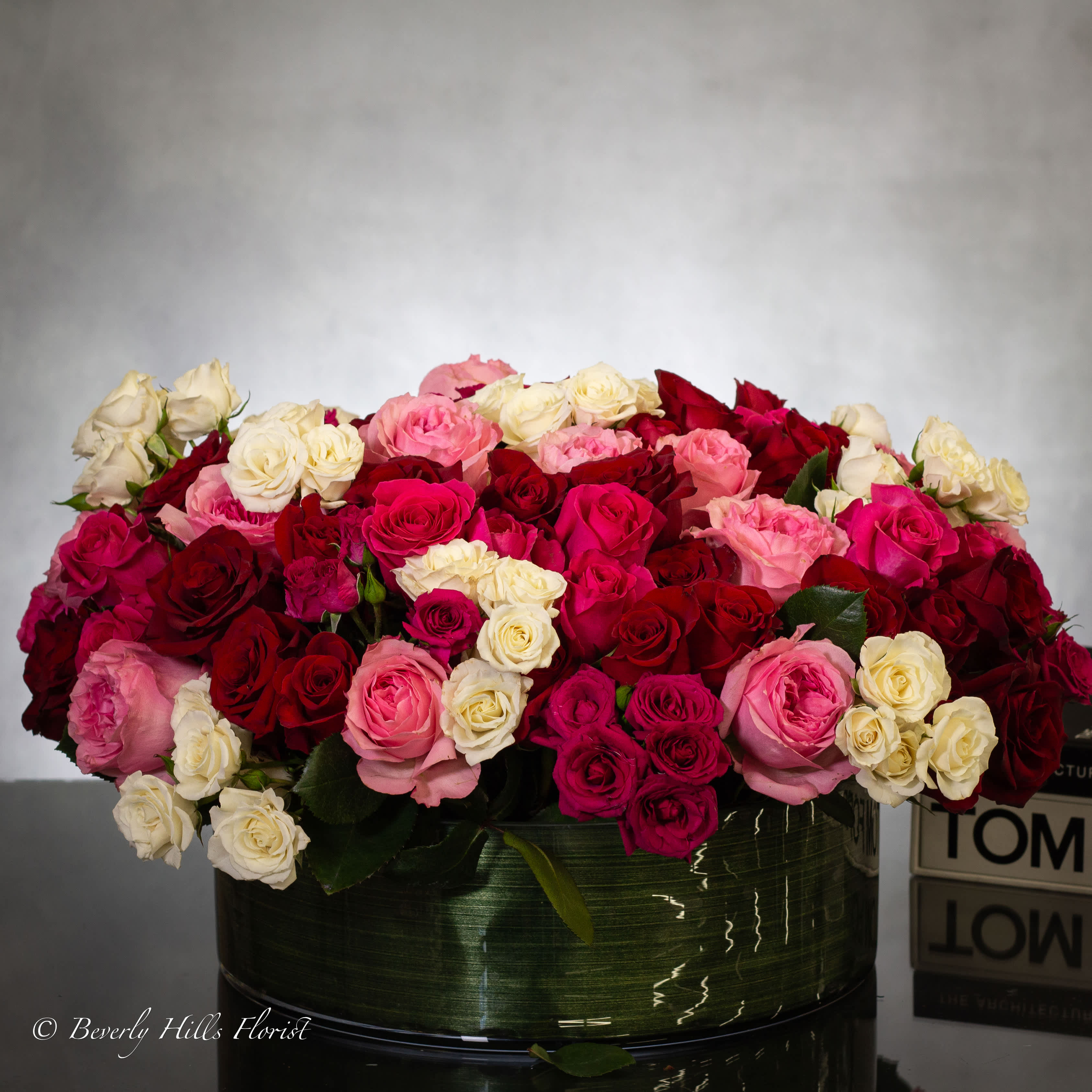 100 Blooms of Love - Pasadena Florist - Presented in a stunning glass vase, it's the perfect centerpiece to express your love this Valentine's Day Low arrangement with over 100 blooms of white, pink, and red ink red centerpiece glass vase i love you valentine. 26&quot; wide and 9&quot; Tall.  