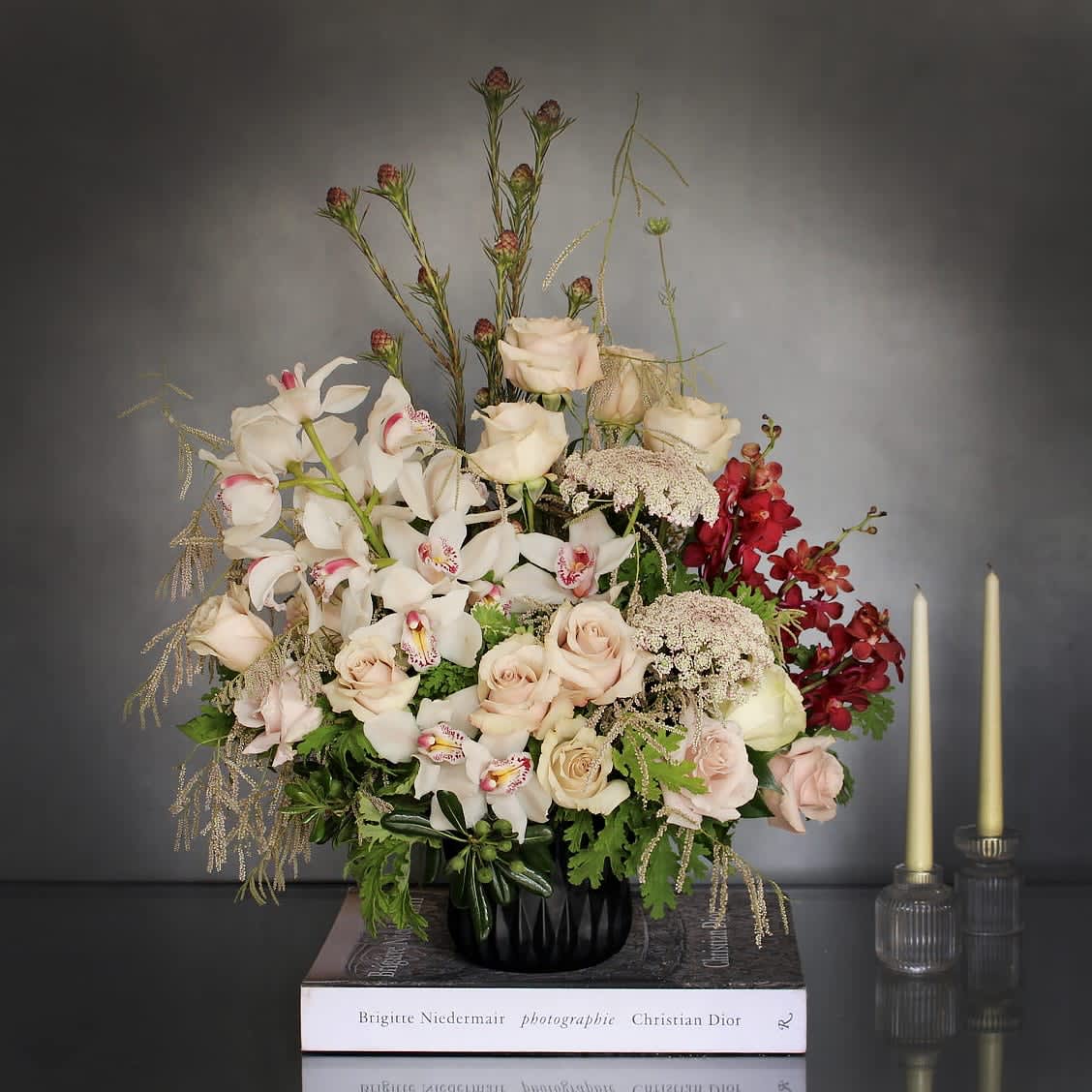Summer Romance - Pasadena Florist  - &quot;Summer Romance&quot; is the perfect combination of soft elegance with a modern touch. A beautiful arrangement made with white Cymbidium Orchids, Roses and various seasonal fillers. An arrangement of romantic elegance.   Measurements:  Vase: 5x5  Arrangement: 26x20