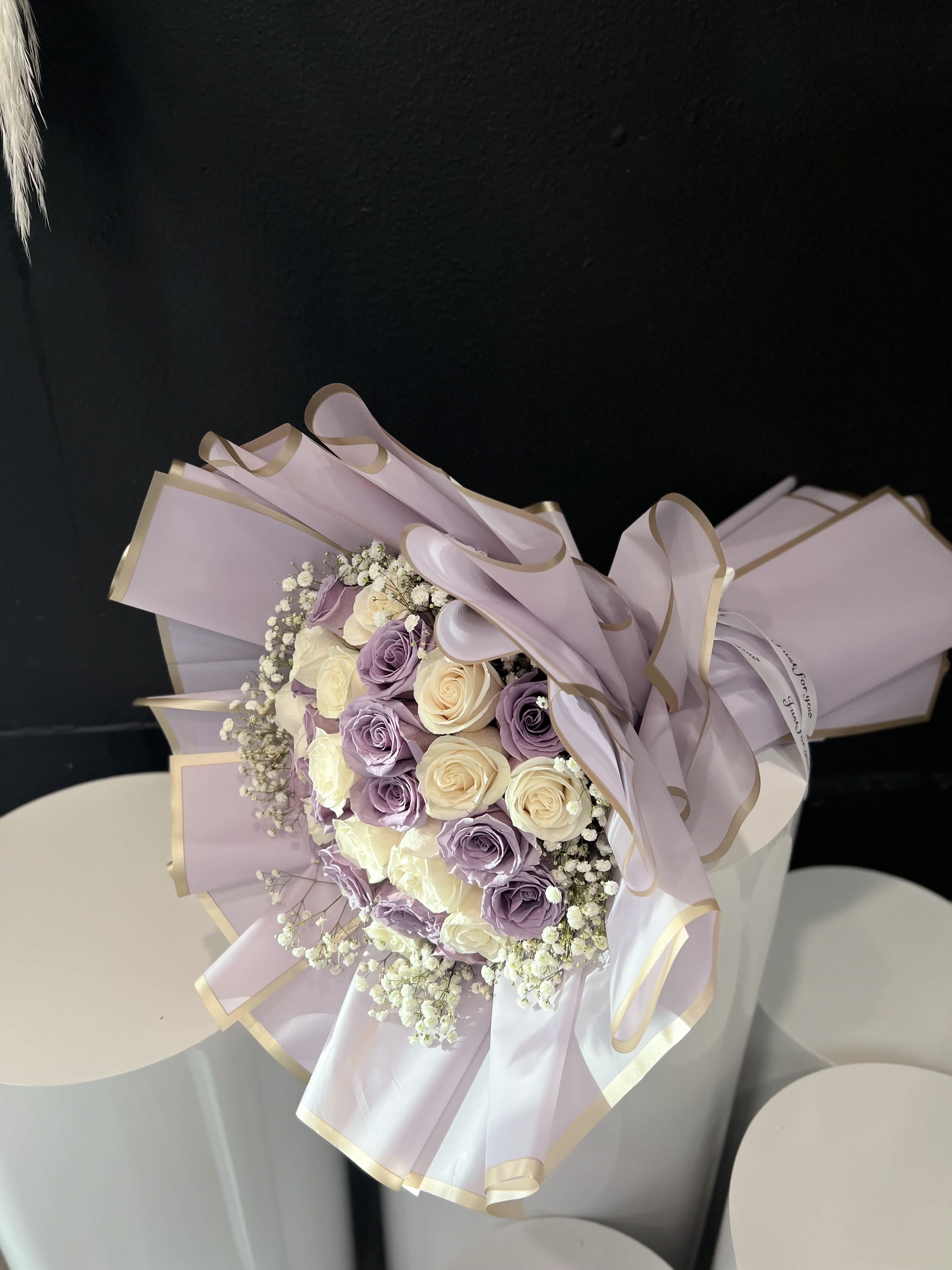 Purple Girl - Lavender 30 roses are thought to be almost mystical in nature. With a meaning tied to enchantment, desire, and magical love, it is often associated with love at first sight. All Lavender Rose bouquets are hand-delivered by a local florist.