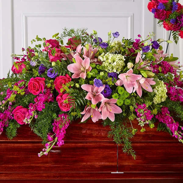 Radiant Tribute Casket Spray - Our Radiant Tribute Casket Spray adds a brilliant spectrum of pinks, greens and purples to every celebration of life. With a collection of stock, hydrangea, lisianthus and roses, our talented designers craft this grand gesture to capture beauty and brightness in every expression of sympathy.