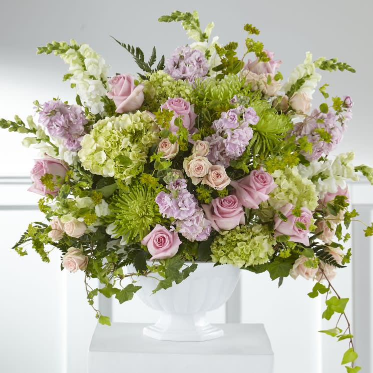 Light Pink and Green Floor Arrangement Light Pink and Green Floor Arrangement - Assortment of light pink and green flowers with greenery. Deluxe option is pictured. May vary from photo