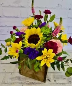Ray of Sunshine Ray of Sunshine - This sunflower and mixed petals arrangement is the perfect pick me up gift for your friends and family. It's like giving a ray of sunshine for your home.