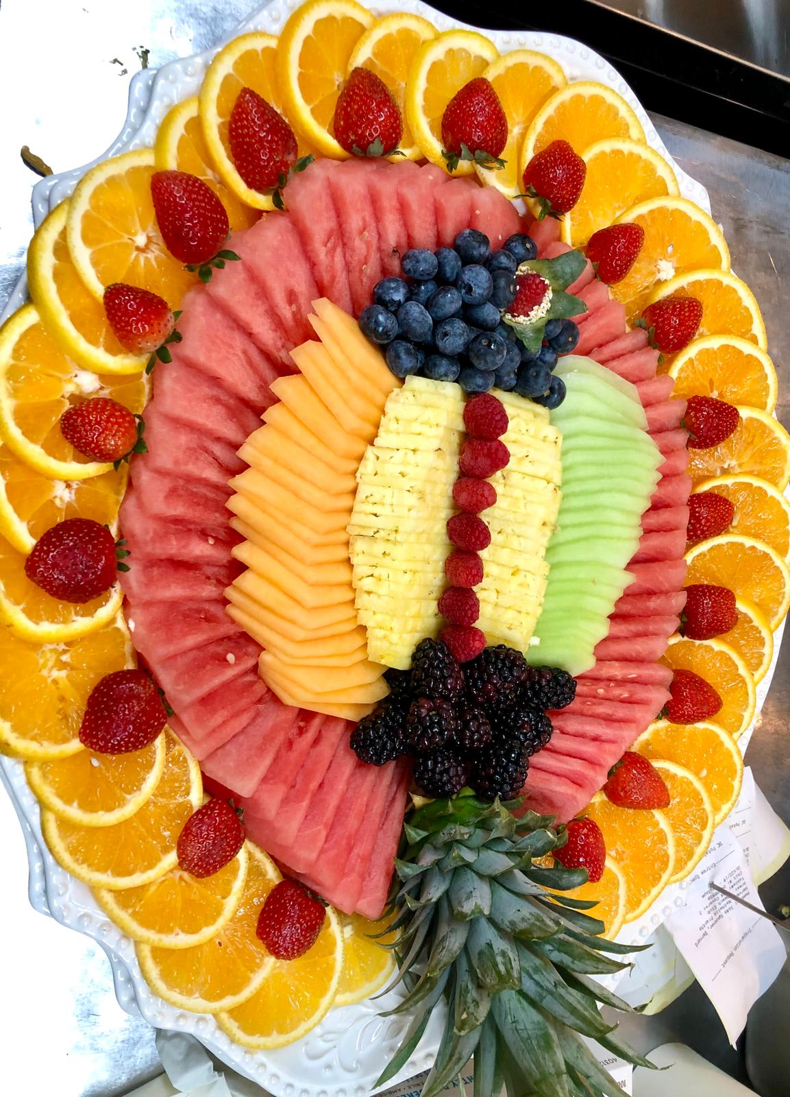 Disfruta Disfruta - elegant presentation of fruit plater. its a mix a fresh fruit availables on the market as watermelon, cantaloupe, pinapple, berries, oranges.