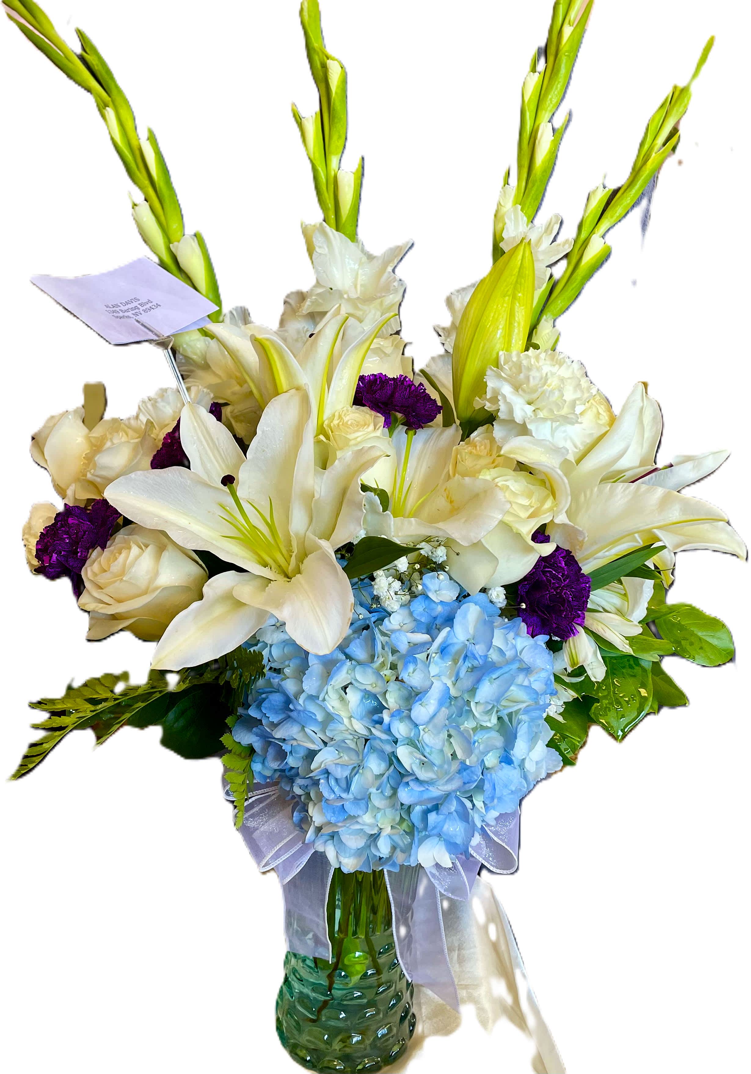 BLISSFUL REMEMBERANCE BLISSFUL REMEMBERANCE - Beautiful sympathy arrangement, to honor the memory of a friend or loved one. This arrangement is primarily white, with slight pops of purple and greens. Approximately 28" in height. It makes a lovely arrangement to send or for the service.