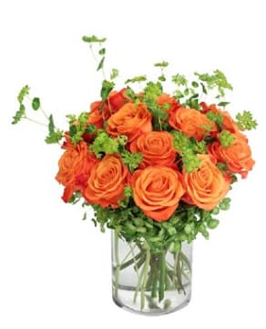 Timeless Tangerine Timeless Tangerine - Orange roses and greenery in a clear crystal vase.