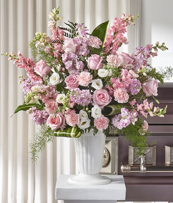 Comfort Divine - The gift of flowers often shares a message of sympathy that words cannot express. For sending condolences that are truly from the heart, our Divine Comfort Arrangement beautifully captures your sentiment. It is elegantly crafted with lisianthus, roses, stock and snapdragons.