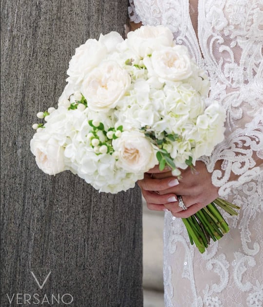 Blushing Bridal Bouquet - Traditionally rounded bridal bouquet featuring seasonal white and blush-toned blooms. Ivory ribbon will finish.