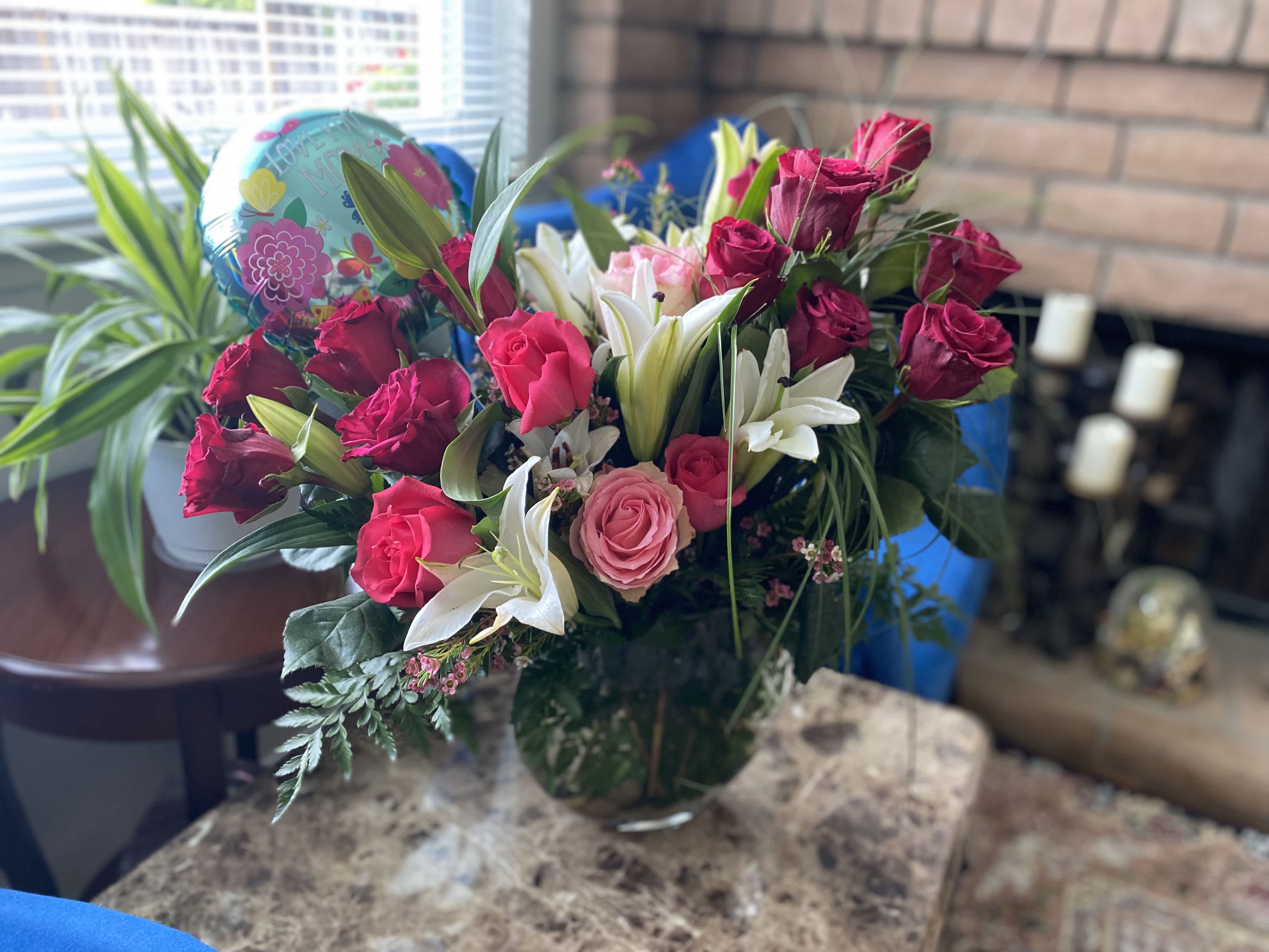 The Art of Arrangement The Art of Arrangement - Unique Arrangement with premium Roses and Lilies