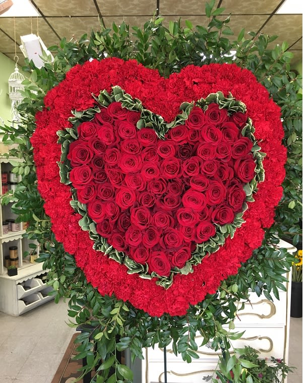 Magnificent Heart Magnificent Heart - Remember a loved one's generous heart with this red arrangement in a classic heart shape, a declaration of eternal love and devotion.