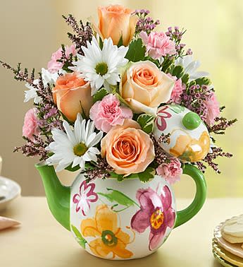 Teapot Full of Blooms Teapot Full of Blooms - Product ID: 138186 Serve up plenty of charm with this two-in-one gift! Our lovely arrangement of pastel roses, carnations and white daisies is beautifully hand-designed inside a reusable floral teapot. âWhen I was little, my best friend and I would have a fun tea party on our birthdays. We still make time to get together to share a cup and some laughs, but now she always serves it in her favorite new teapot!â said Danielle from our Product Development team. Charming bouquet of peach roses, light pink mini carnations, white daisy poms, pink calcynia, pink waxflower and variegated pittosporum Arranged in a floral print teapot; measures 8"H x 8"W x 5"D Tea pot is reusable & food safe; hand-wash only Large arrangement measures approximately 10.5"H x 7"L Small arrangement measures approximately 9.5"H x 6"L Our florists hand-design each arrangement, so colors and varieties may vary due to local availability