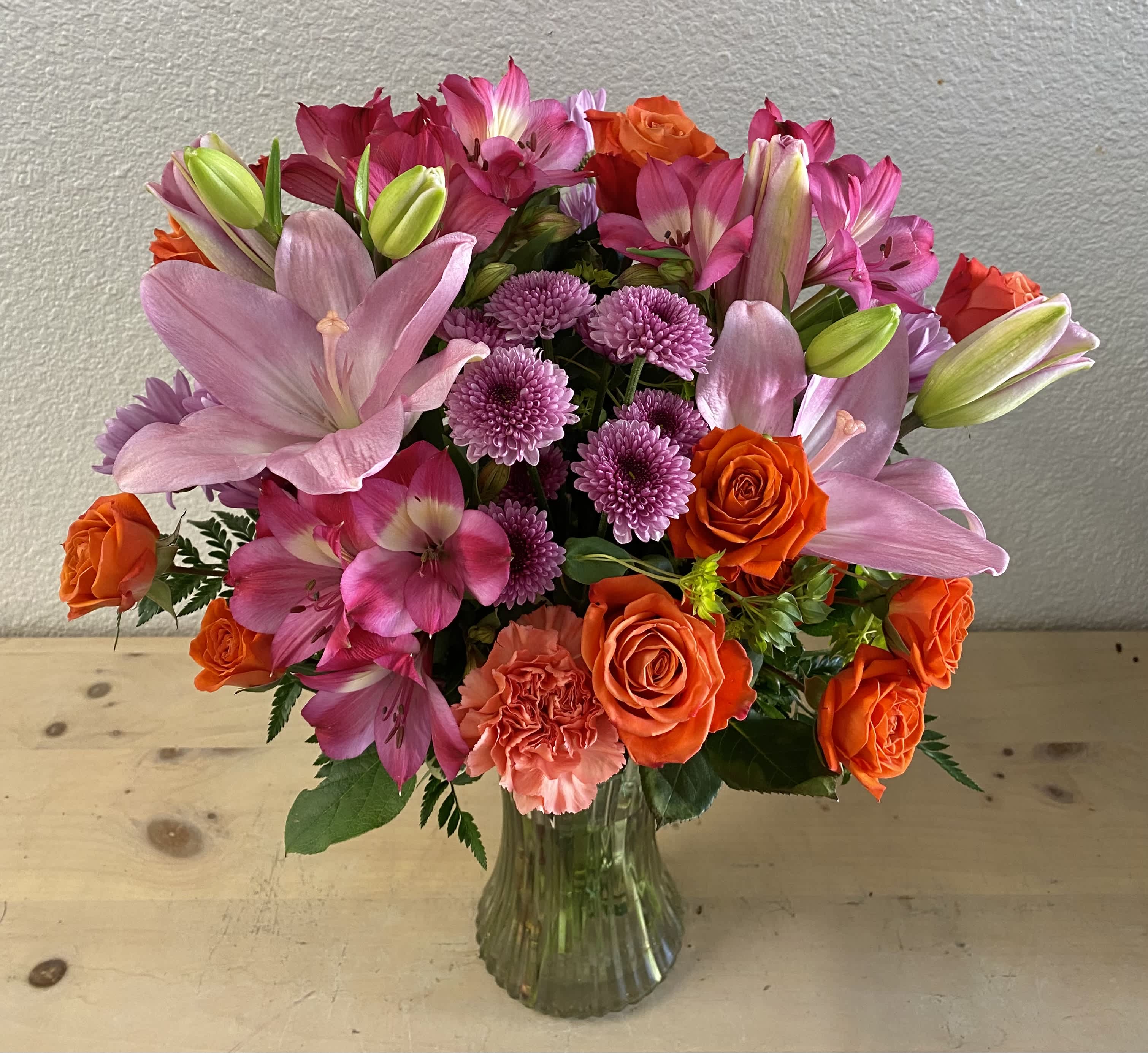 Natural beauty Natural beauty - Pink lilies, lavender cushion, orange spray roses, pink alstroemerias, lavender daisies, light orange carnations.