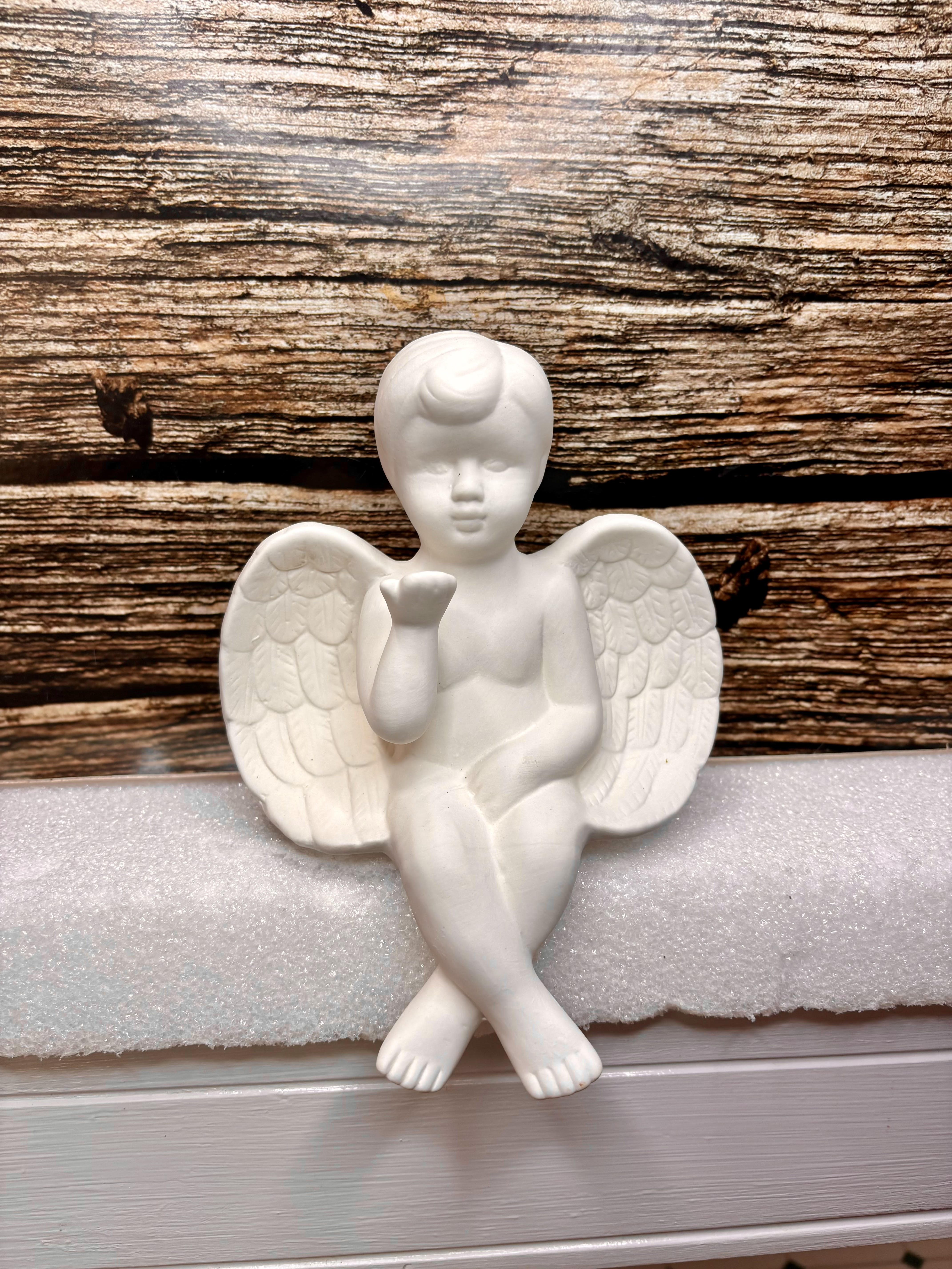 Kissing Cherub Angel  - A ceramic angel who sits on the edge while blowing you kisses. 
