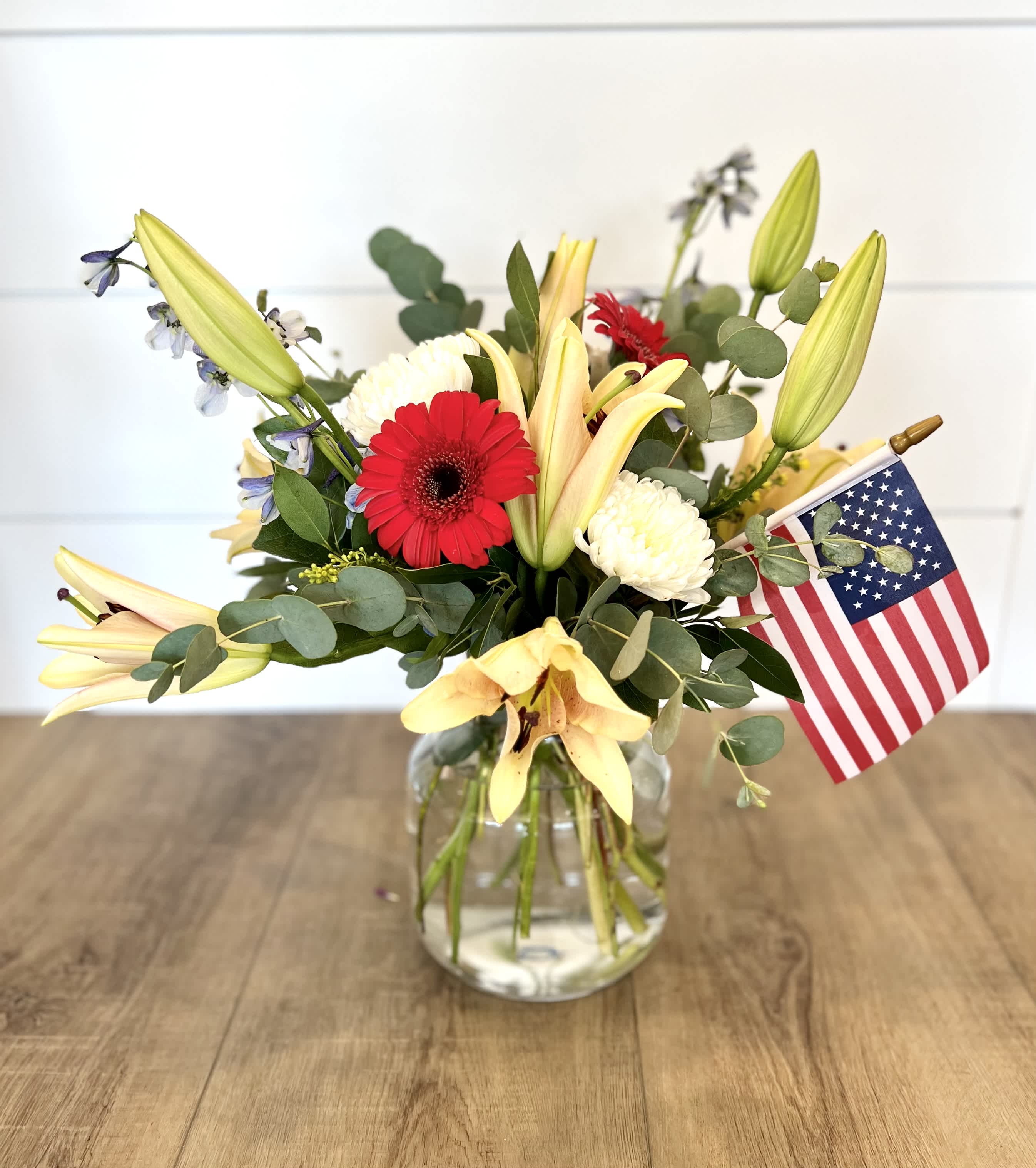 America the Beautiful - Featuring Gerber Daises, Lily's, and Blue Delphinium, 