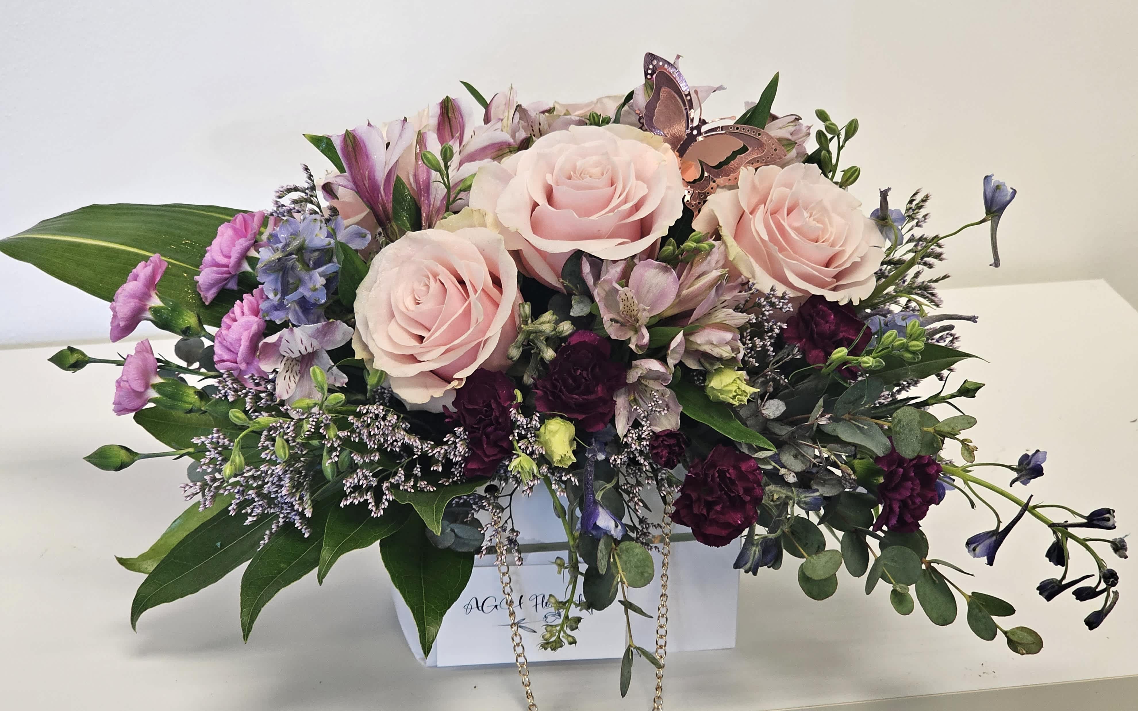 Beautiful arrangement in the paper bag  - This is very nice arrangement for your special day.