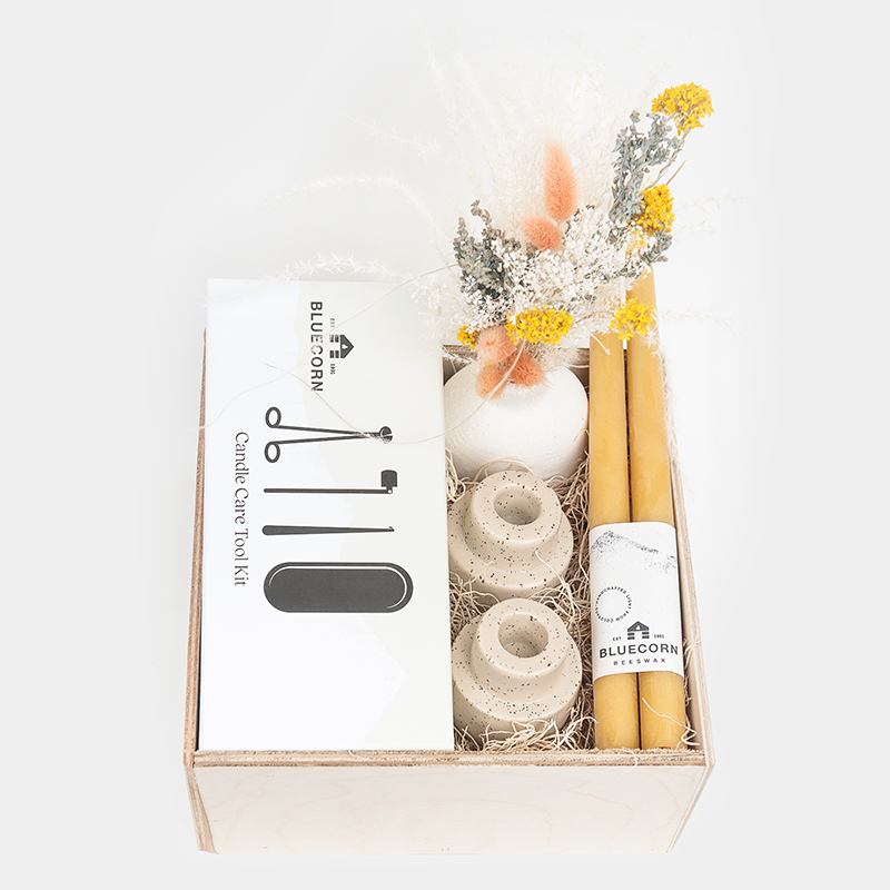 Candle Lover's Gift Box - Yellow - The perfect gift for the candle lover in your life!  Gift Box Includes:  * 1 set of Yellow Bee's Wax Candles * 2 Ivory Speckled Taper Candle Holders * 4-piece Candle Care Kit (includes one wick trimmer, one candle snuffer, one wick adjuster, and one tool storage tray)  * 1 Everlasting dried floral bouquet in a Cream Ceramic Bud Vase.   All items are carefully arranged in a natural 10x10 wooden box. 