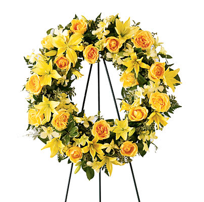 Bright Memories Wreath Bright Memories Wreath - This beautiful wreath holds golden yellow roses, Asiatic lilies and Peruvian lilies, against a background of assorted greenery. An expression of your friendship and sympathies. Approximately 23" dia.H" X W"