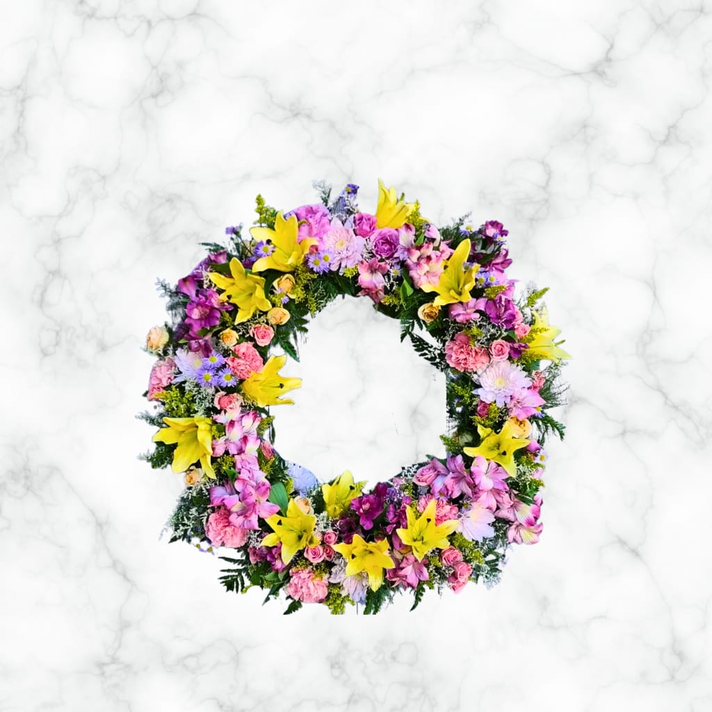 Warm Thoughts Wreath Warm Thoughts Wreath - “Warm Thoughts” This is one of those classic designs for Sympathy Flowers that always stands out as something really special. Standing wreaths and sprays like this are one of those items we are known for. Creating in a way that really showcases the beauty of the flowers is what we love to be able to do. Highlighting the beauty of flowers is how they add soothing life to, and for a celebrated life well lived. Created in shades of yellows, pinks, and purples, this is a design that looks wonderful in a variety of color combinations. If you have any special requests for color please don't hesitate to give us a call at the shop. We're here to help. Specialty Floral Design is a local florist in Olympia, WA, we deliver to the surrounding funeral homes of Olympia, WA. If you have questions please don’t hesitate to call us.