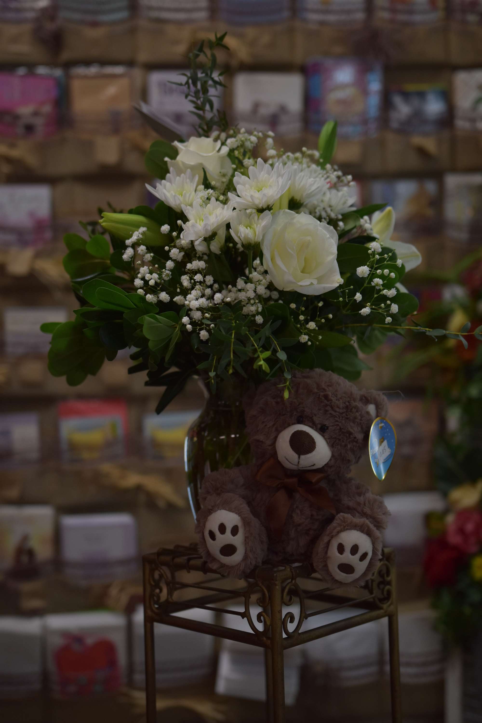 Beary Cool Beary Cool - A cuddly plush bear is included with this cool mix of white flowers.