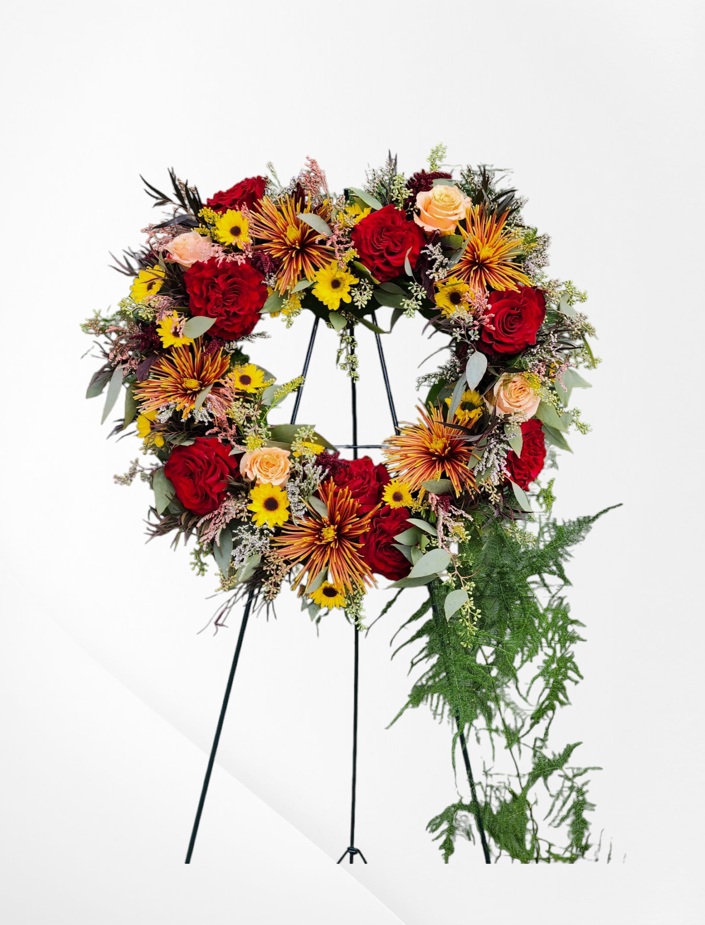 Fall Garden Blooms Fall Garden Blooms - Amidst the challenging times of bidding farewell, our flower shop in Olympia, WA, extends its services for delivering solace through thoughtfully crafted funeral flower arrangements. Serving customers across greater Thurston County, WA, we ensure prompt deliveries. Our team specializes in curating beautiful, soothing arrangements, drawing from a diverse selection of flowers. Whether it's for a heartfelt tribute at a funeral or to convey sympathy, our experienced designers carefully select blooms to create a special arrangement. While our expertise is in creating flowers for various occasions, we understand the significance of conveying comfort during moments of loss. Rest assured, our meticulously designed funeral flowers aim to offer solace and serve as a touching tribute to honor a cherished life. Fall Garden Blooms Our Fall Garden Blooms arrangement embodies the vibrant and warm hues of autumn, creating a serene and comforting display. This exquisite arrangement, shaped as a heart-standing spray, symbolizes eternal love and remembrance. It features a blend of seasonal flowers such as chrysanthemums, sunflowers, roses, and asters, carefully arranged to reflect the beauty and tranquility of the fall season. Each bloom is thoughtfully chosen to provide a sense of peace and to celebrate the cherished memories of your loved one. Flower Symbolism for Funeral Services The flowers in our Fall Garden Blooms arrangement are not only visually stunning but also carry deep meanings that add to their significance: - Chrysanthemums: Often associated with death and mourning in many cultures, chrysanthemums symbolize honor and respect. - Sunflowers: Representing adoration and loyalty, sunflowers provide a sense of warmth and positivity, reminding us of the joy brought by the deceased. - Roses: Different colors of roses convey various sentiments; red roses symbolize love and grief, while yellow roses signify friendship and remembrance. - Asters: Known for their star-like appearance, asters symbolize patience, elegance, and a love of variety, making them a beautiful tribute to a well-lived life. Standing Spray for Versatile Sympathy Needs The heart-shaped standing spray is a perfect choice for various ceremonies, including church services, funeral homes, or graveside ceremonies. Its elegant design and sturdy stand ensure it remains a stunning focal point throughout the service, offering comfort and a heartfelt tribute. The standing spray's versatility makes it an ideal selection for honoring your loved one's memory in any setting. Customization and One-of-a-Kind Service We understand that every individual is unique, and so should be the tribute that honors their memory. Our talented designers are committed to crafting personalized arrangements that reflect the personality and preferences of the departed. You can work closely with our team to customize the Fall Garden Blooms arrangement, ensuring it aligns with your vision and holds special meaning. Our Delivery Services At Specialty Floral Design, we prioritize timely and reliable delivery services. We offer prompt delivery across Olympia, Lacey, Tumwater, and the greater Thurston County area, ensuring your arrangement arrives fresh and beautiful. Our dedicated delivery team handles each order with the utmost care and respect, understanding the importance of these moments. Contact Us For any questions or special requests, please contact us at 360-688-6608 or visit our shop in Olympia, WA. Our compassionate and knowledgeable staff is here to assist you in selecting the perfect arrangement to express your sentiments during this difficult time. Trust Specialty Floral Design to provide heartfelt and beautiful tributes that honor and celebrate the lives of your loved ones.
