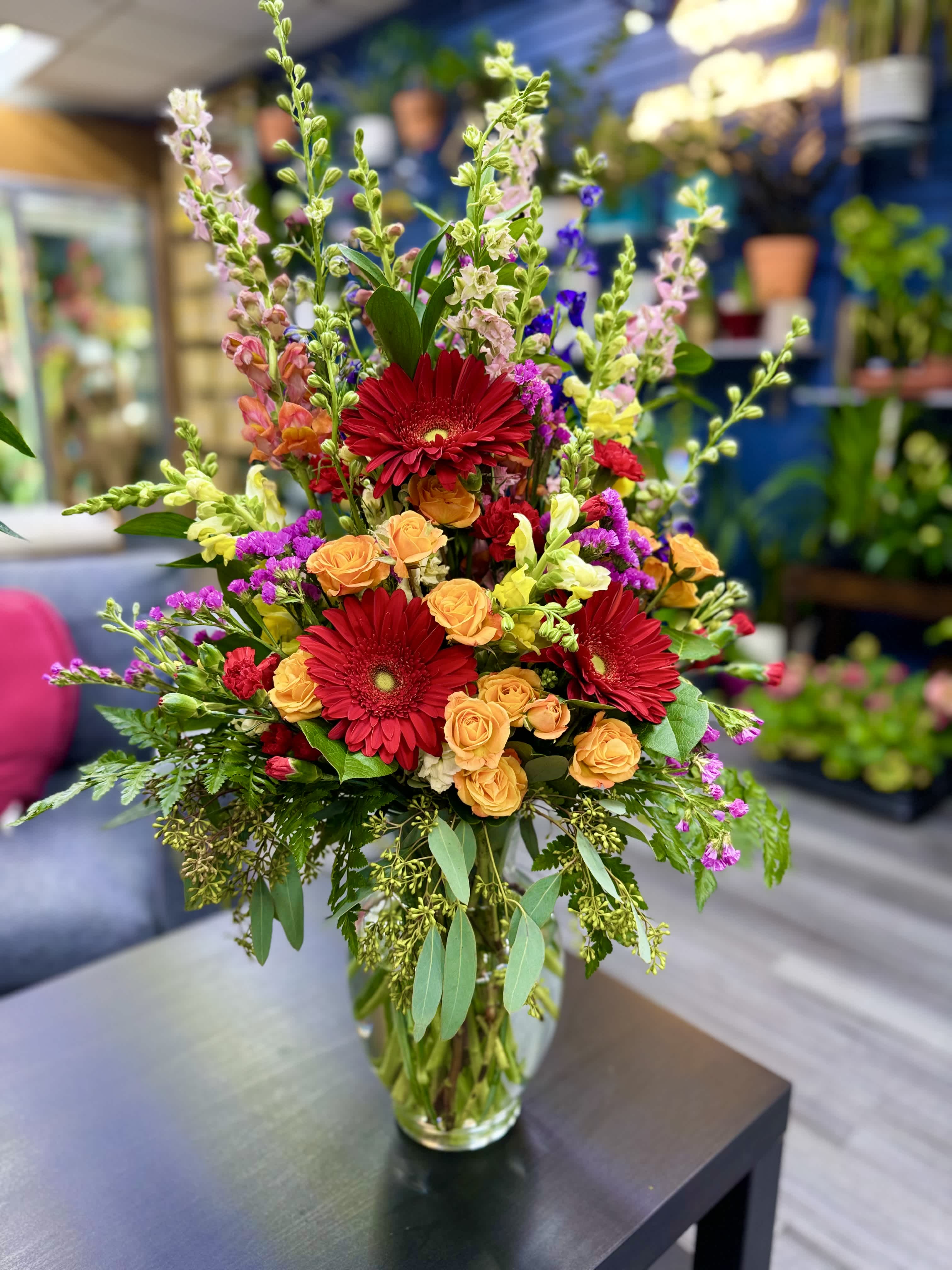 Multicolor Garden Multicolor Garden - “Dive into the lush beauty of the Multicolor Garden, where the freshness of Gerbera daisies intertwines with the vibrant energy of mini red carnations and the delicacy of mini orange roses. Snapdragons and larkspur flowers complete this floral spectacle with their vivid hues and unique textures. An arrangement that celebrates the joy and diversity of nature, perfect for brightening any space with its explosion of colors."