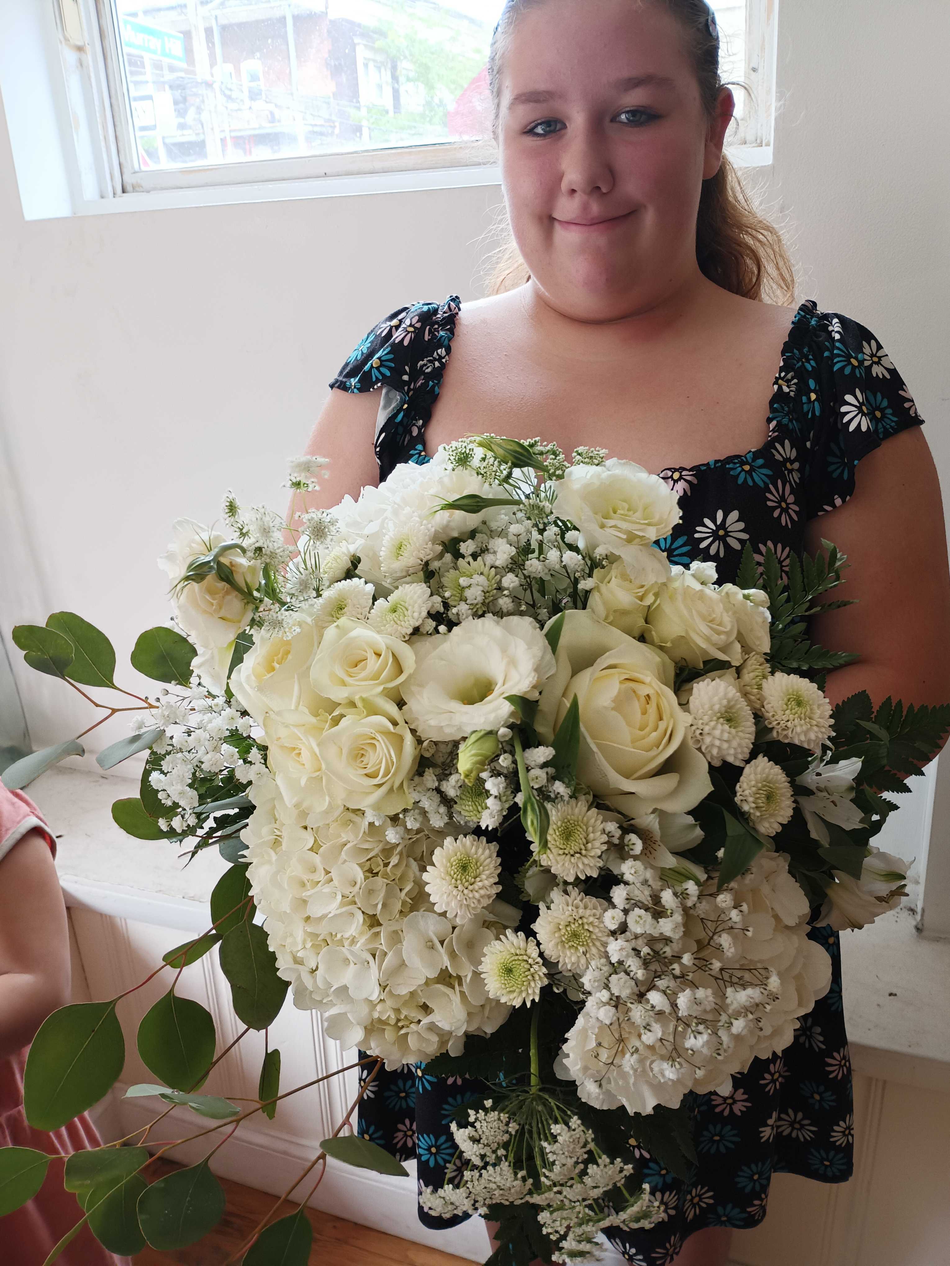 Lindsey bridal bouquet - beautiful all white roses, carnations, daisies, baby's breath, quine Anne lase, Lisiantus, Alstroemeria, greens hand tied.