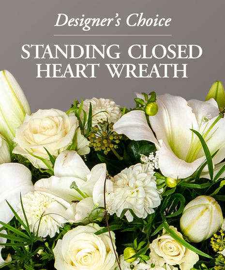 Designer's Choice - Closed Bleeding Heart - Send a sympathy floral standing closed heart created by one of our floral experts. Seasonal flowers are arranged in this beautiful gift to show your care and concern; pastel roses, lilies, mums, snapdragons and more. You can get in pastel shades, bright and colorful, or in all white flowers. Standing sprays are an appropriate gift for delivery from a family member, friend or co-worker. Delivery is available directly to a funeral home or places of worship.