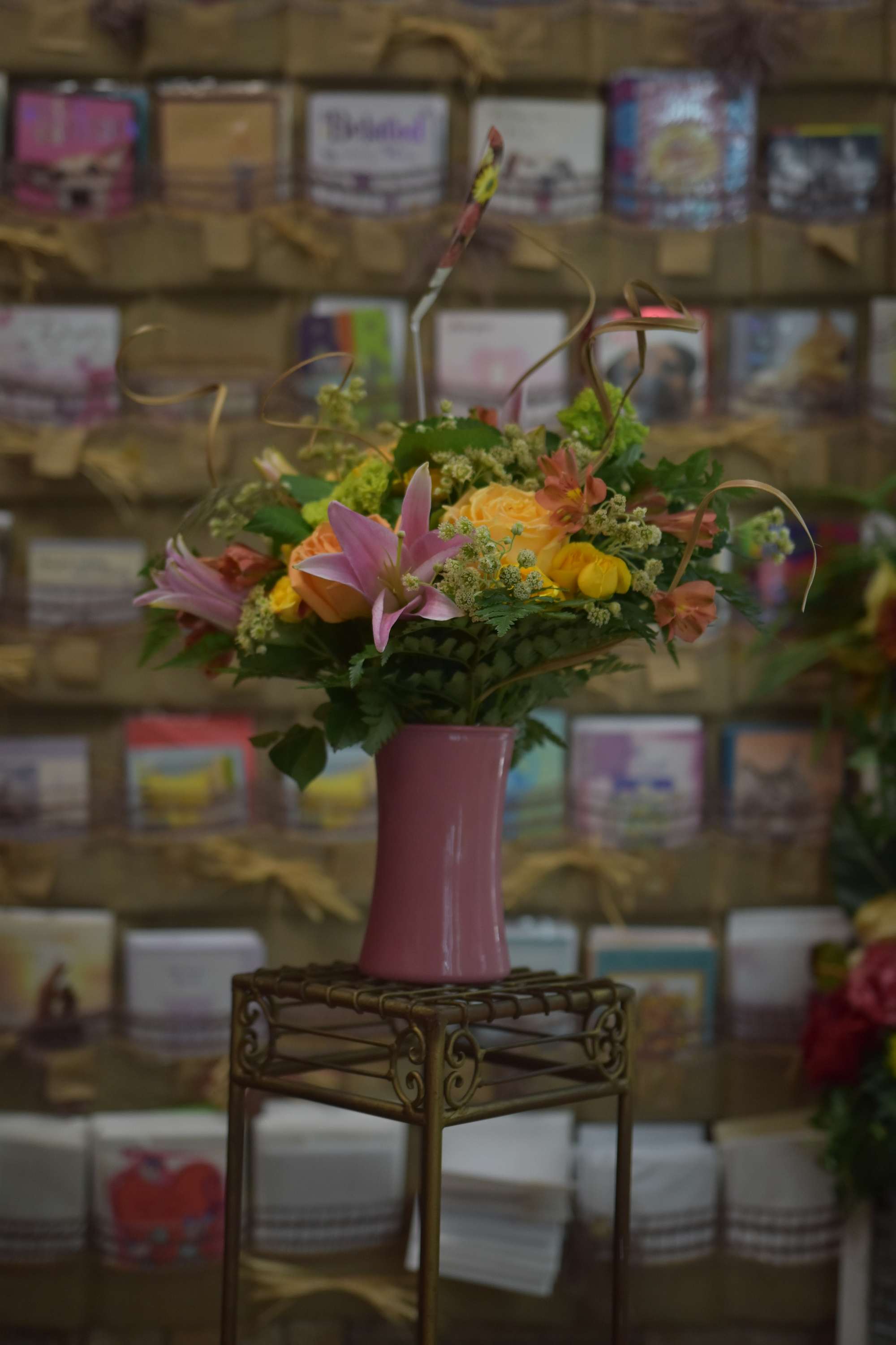 Candy Hearts Candy Hearts - A sweet pink and yellow arrangement filled in a stylish pink vase with lush greenery and accent flowers. This sweet combination of yellow and pink will remind anyone of your love for them.