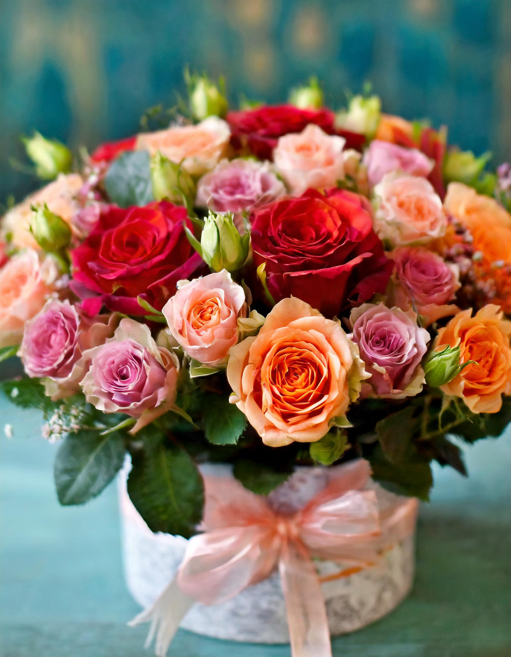 Montecito - A luxurious arrangement indeed! Mixing bright colors like hot pink and peach roses with other vibrant flowers can create a stunning visual impact. The perfect gift for someone who appreciates beauty and luxury!  Disclaimer: IMAGES PROVIDED ARE ALL IN STANDART SIZE. Photos and visual presentation of the products represent an overall style, look and feel, which we may not be able to identically replicate in some instances.
