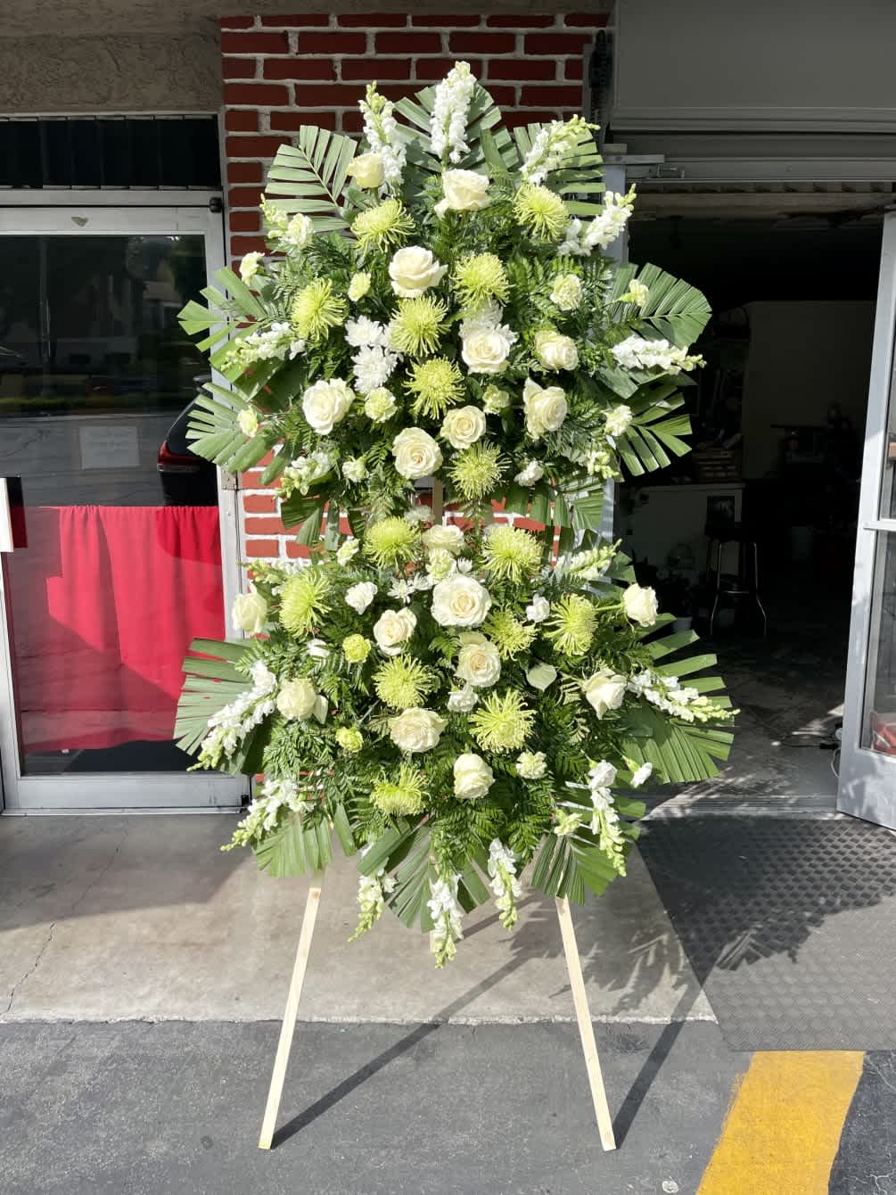 Korean Double Standing Spray - Traditional Korean style funeral spray encompassing two floral spray. The easel stands an impressive 6 ft. tall. If you desire an specific color theme please specify the colors in the special instruction box. Approximate overal demensions are (H) 6'6&quot; (W) 40&quot;. Banners are available at no extra charge on this order.