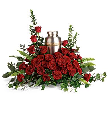Forever In Our Hearts Cremation Tribute - An elegant tribute to a rich, radiant life, this breathtaking bouquet of resplendent red roses and delicate greenery makes a beautiful presentation of the cremation urn. Red roses are arranged with myrtle, green ivy, sword fern, silver dollar eucalyptus, and lemon leaf. Arrangement does not include urn.