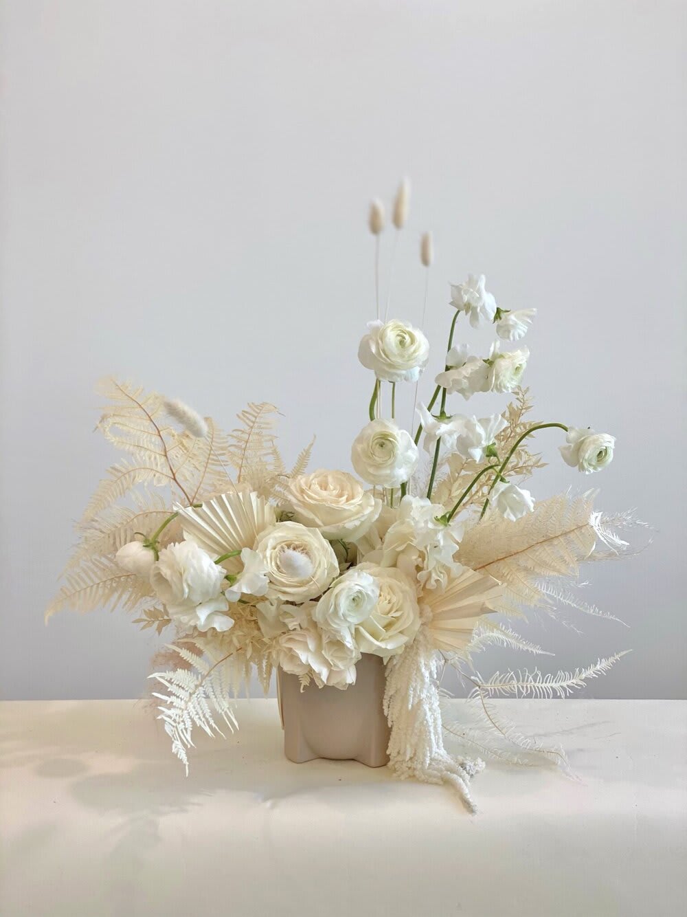 ONLY NUDES YOU NEED TO SEND - - Charming arrangement in soft whites and neutral tones - Adorned with delicate dry flowers for a whimsical touch - Serene beauty and subtle textures evoke tranquility - Understated elegance perfect for any space