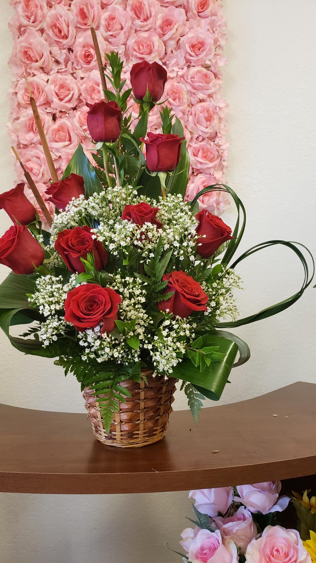 My Heart My Heart - Eleven red Roses baby breath aspidistra leaves, a spectacular arrangement with red Roses in a basket show your love with this beautiful arrangement.