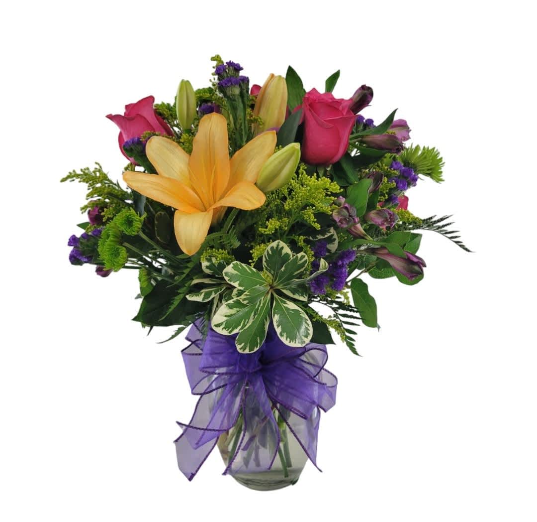 Blissfully Bright - A beautiful mix of vibrant colors using flowers such as hot pink roses, orange lilies, green poms, purple alstro and yellow solidago. 