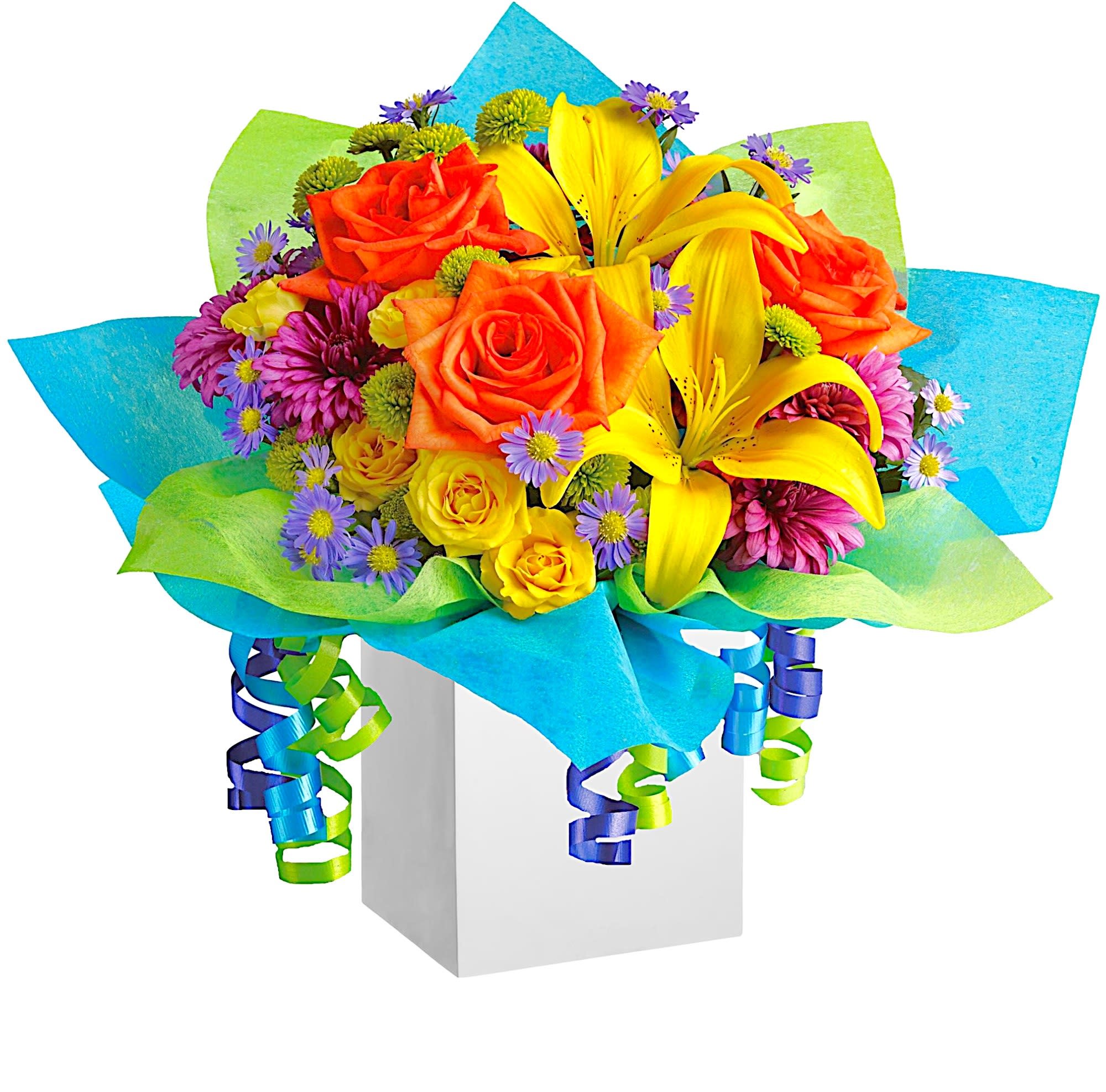 Rainbow Present - All the colors of the rainbow are present in this fabulous gift arrangement. It's so bright, so brilliant and so unique, it will put anyone in the mood for celebrating!  DETAILS Stunning orange roses, yellow spray roses and Asiatic lilies, purple monte cassino asters and cushion spray chrysanthemums plus green button spray chrysanthemums and more are all arranged in a wooden box. Colorful and classy!  Item # NF-59  FLORIST-TO-DOOR  Orientation: One-Sided  BLOOM DETAILS Roses Spray Roses Cushion Mums Button Mums Montecasino Aster Filler Greenery  The Standard Arrangement is approximately 17&quot; W x 14&quot; H. The Deluxe Arrangement is approximately 17&quot; W x 14 1/4&quot; H. The Premium Arrangement is approximately 17&quot; W x 14 1/2&quot; H.  Designed by our award-winning florist designers.  HOW TO CARE FOR YOUR FLOWERS 1. Keep in a location without direct sunlight and away from extreme heat or cold. 2. Add water regularly to keep floral foam moist and mix in the flower food packet provided. 3. Trim the stems at an angle every other day. 4. As flowers/foliage wilt, remove &amp; discard  Please Note: The arrangement pictured reflects an original design for this product. While we always do our best to follow the original flower recipe, the exact flower or container is sometimes unavailable. We may replace items of equal or greater value to deliver the freshest flowers possible while keeping the style &amp; color palette. We assure you that we will create a beautiful, fresh flower arrangement with only the best quality flowers to keep you as a loyal customer.  How to place an order? We have several options. 1. You can place an order directly on this secure website... OR 2. You can call in your order by dialing: (323) 262 - 9238... OR 3. You can visit our store (appointment recommended 323.262.9238)  NINFA'S FLOWERS 2405 WHITTIER BLVD. LOS ANGELES, CA. 90023  ATTENTION: *Please note that on busy holidays, Valentine's Day, and Mother's Day, we cannot verify if the recipient received the flowers until the following day because our drivers don't turn in their signature delivery tablets until the following day. You can verify delivery on the website after 10:00 pm, call 323.262.9238 the following day after 10:00 am, or contact the recipient directly if you haven't received a call from them. Thank you for your patience and understanding.