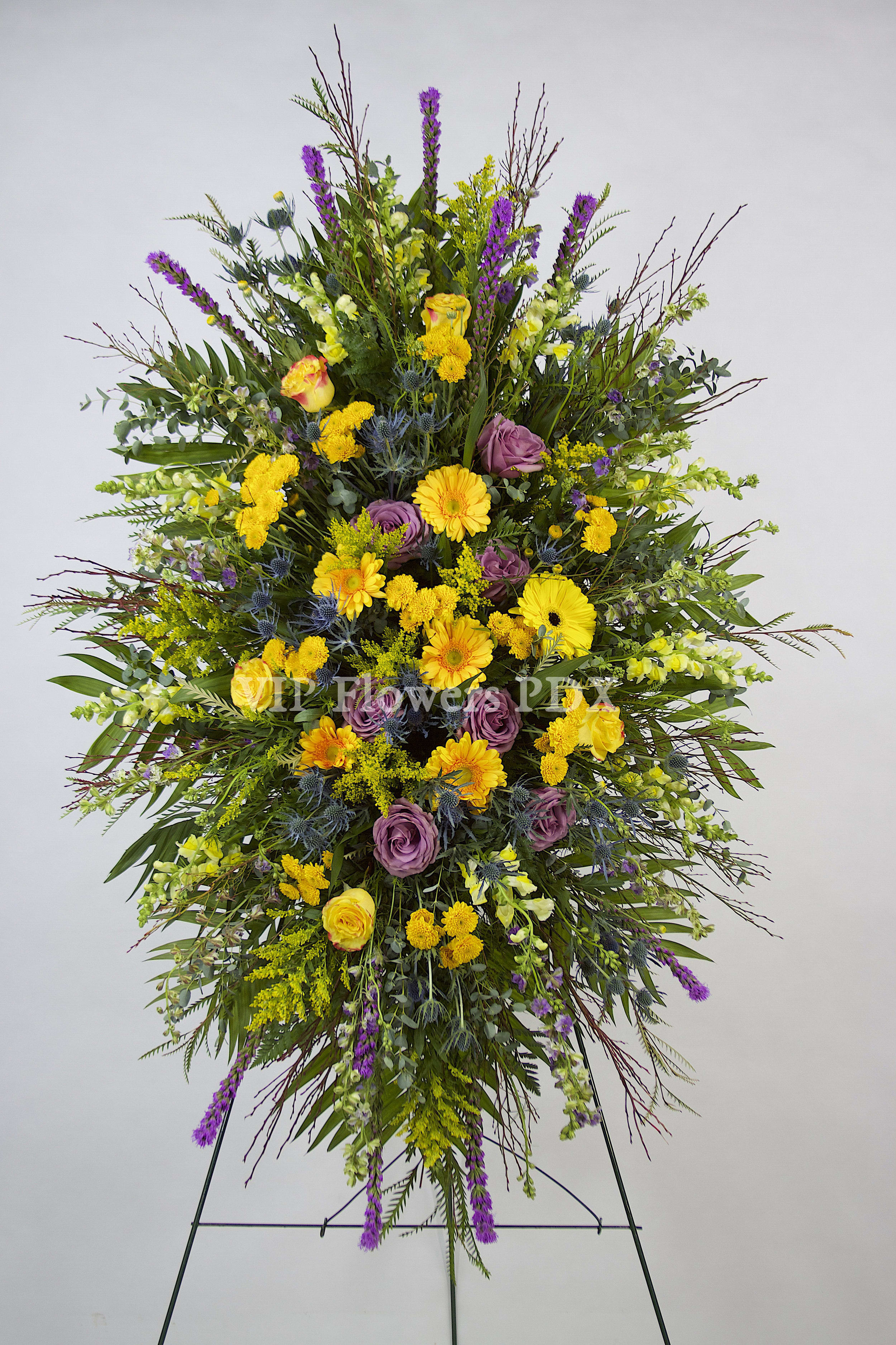 Garden of Yellows - Photo is shown as DELUXE OPTION  Flowers Included:  Gerberas Roses Snapdragons Daisy Mums Liatris Seasonal Greens       Substitutions may be necessary to ensure your arrangement or specialty gift is delivered in a timely manner. The utmost care and attention is given to your order to ensure that it is as similar as possible to the requested item (Please note that some flowers and colors may vary due to seasonality.)