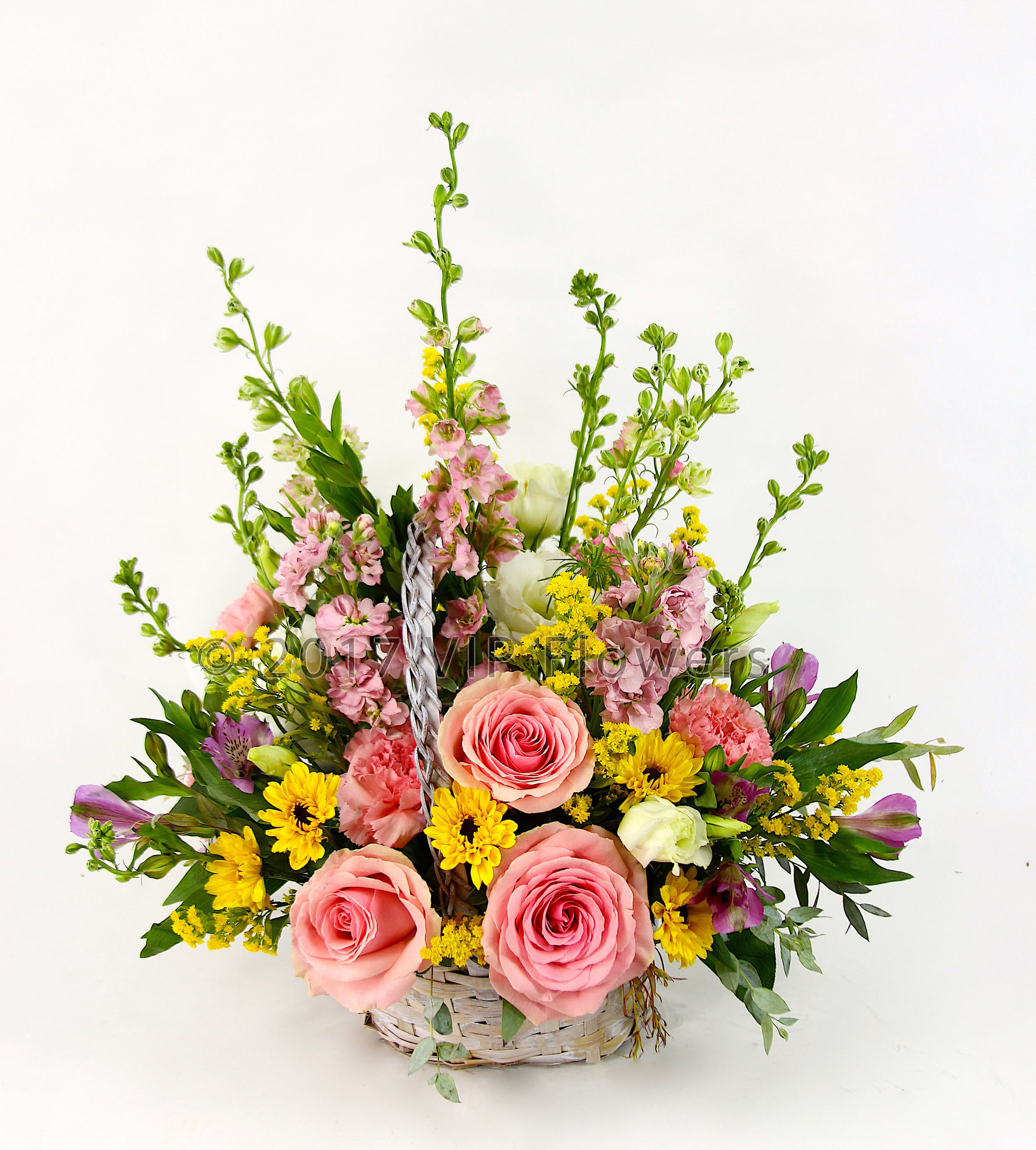Pink Basket of Joy - Flowers Included:  Pink Roses Pink Carnations Pink Larkspur Astromeria  Pink Stock Yellow Mums White Mums Seasonal Greens       Substitutions may be necessary to ensure your arrangement or specialty gift is delivered in a timely manner. The utmost care and attention is given to your order to ensure that it is as similar as possible to the requested item (Please note that some flowers and colors may vary due to seasonality.)