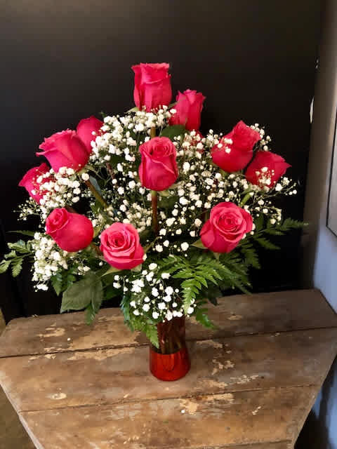 Pink Perfection - Send her a classic - one dozen pink roses in a cloud of babies breath, nestled in a classic vase.