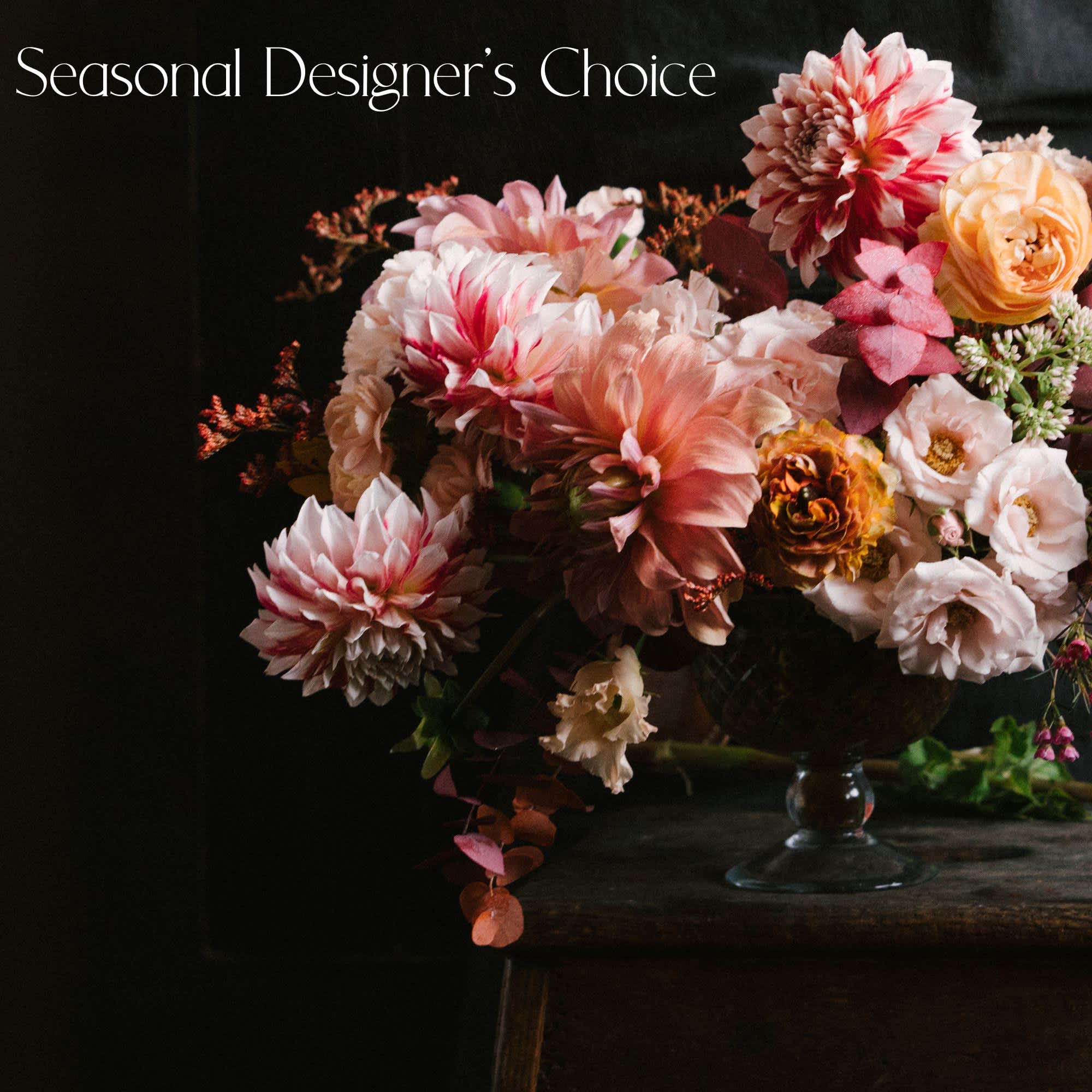 Seasonal Designer's Choice Arrangement Seasonal Designer's Choice Arrangement - Our designers will take inspiration from the flowers and foliage that are in season, and create a gorgeous arrangement to wow your recipient. Designer's choice is always the best way to get the most bang for your buck. We will create a gorgeous arrangement to maximize your budget. The arrangement seen in the photo is just an example. We will reach out to you to build a custom design based on your needs, your budget, and seasonality. No flower types are guaranteed - seasonal arrangement!