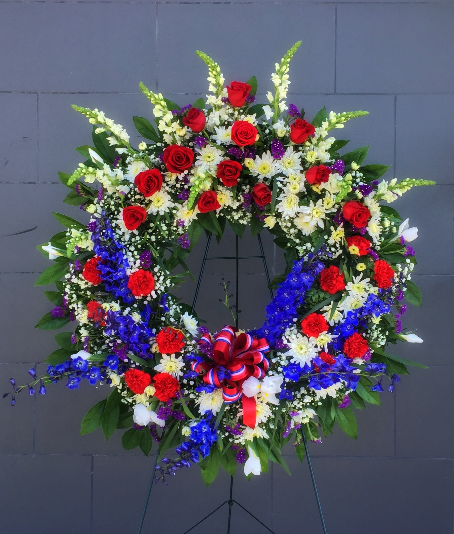 American Pride - Funeral wreath including red, white and blue flowers.