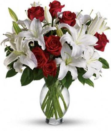 Teleflora's Timeless Romance - Long Stemmed Roses Teleflora's Timeless Romance - Long Stemmed Roses - This exquisite rose and lily bouquet is a reminder that love is a many-splendored thing. Timeless romantic red roses and fragrant white lilies in a simple glass inspiration vase � a sweet yet spectacular way to express what�s in your heart. She�ll melt. (vase may vary) Item # TRS04-1A