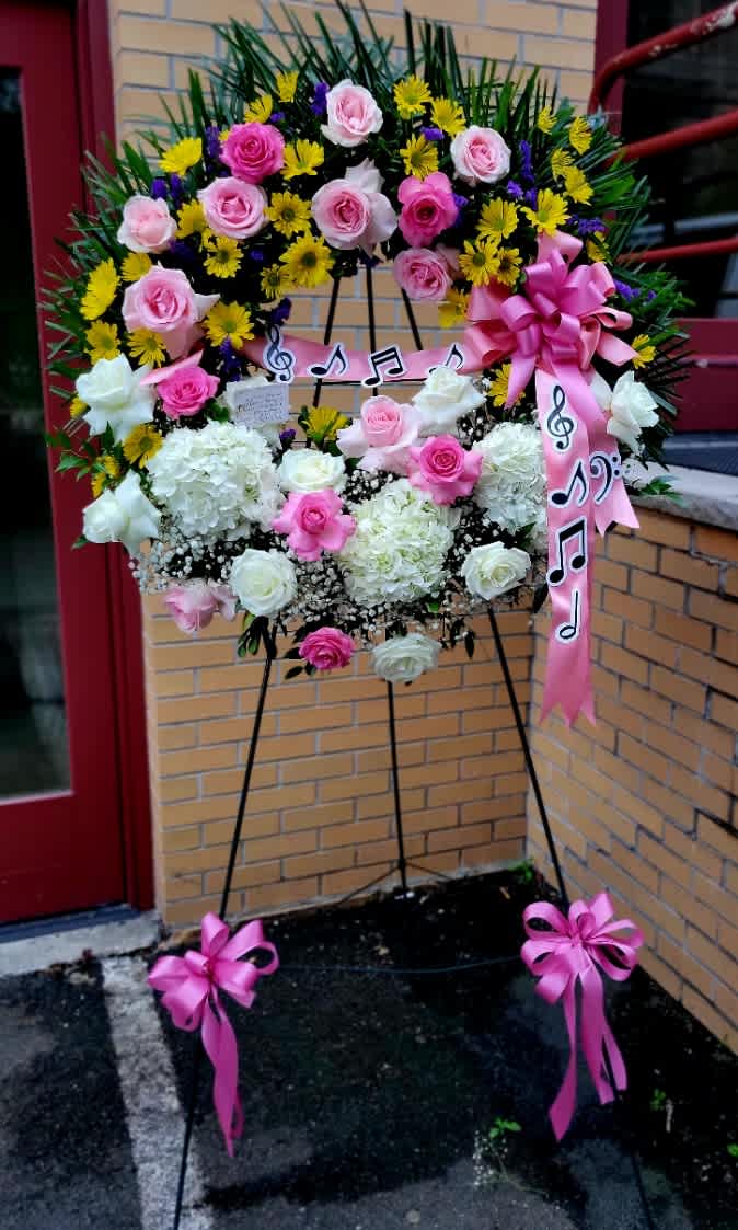 Sympathy Wreath for the Music Lover. - The Overall size of this beautiful piece is 72&quot; Tall.  The wreath itself is approximately 30&quot; circumference. Flowers used are a feminine collection of spring flowers.  It can be made with different color combination.  