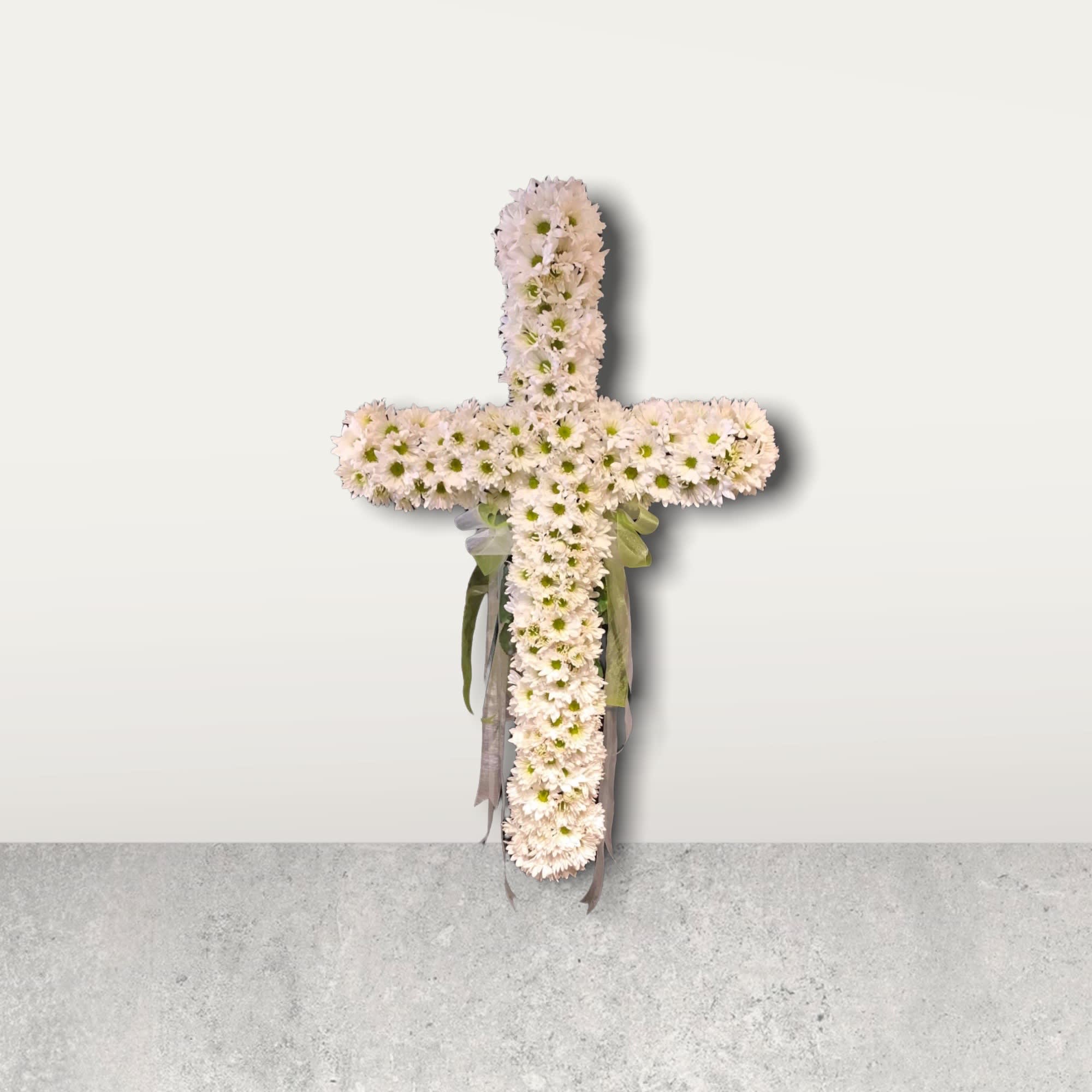 Memorial Cross with fresh White Daisies Memorial Cross with fresh White Daisies - Dozens and dozens of white daisy blooms nestled together in the shape of a cross. Sweet tribute for any loved one. Fresh flowers in 18" oasis cross on a 54-60" wire easel. Strong statement of your love and faith. (other colors may be available, call us to see 615.599.9950)