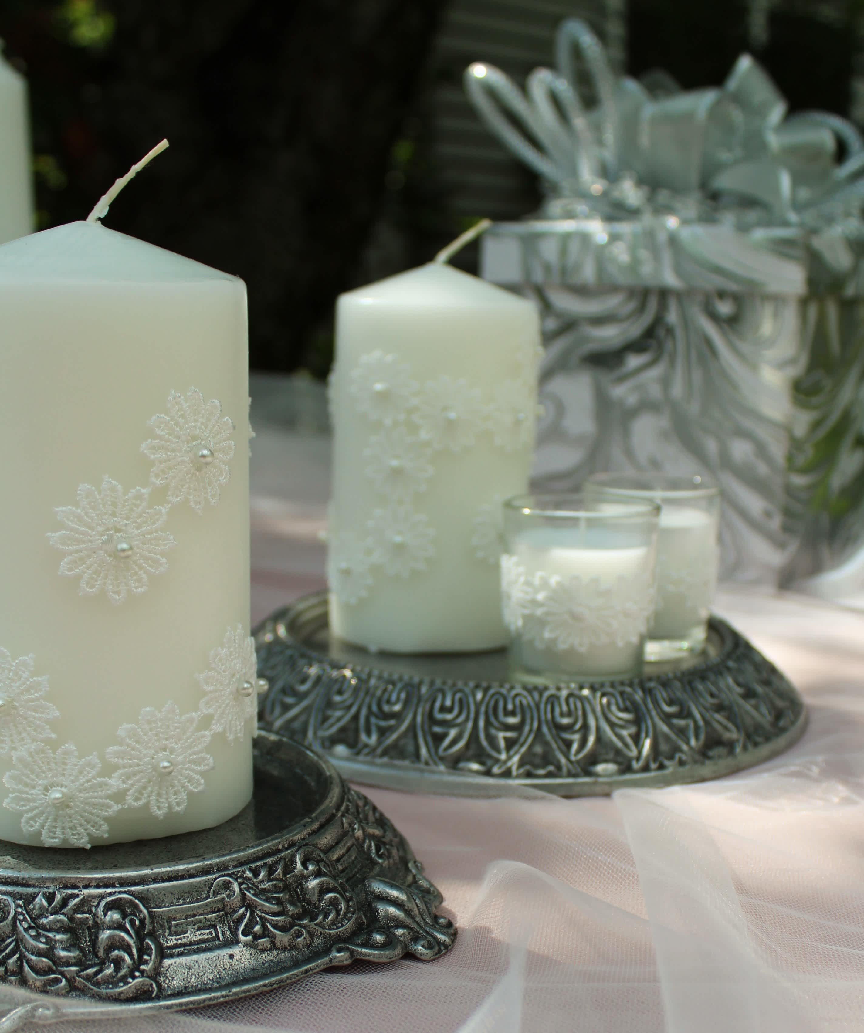 Lace and Pearl Wedding Candles - These beautiful lace adorned, pillar candles will add an extra touch of elegance to your wedding decor.  They come in a set of 3.  These can also be custom made to suit your wedding colors.  Give us a call and we will be happy to help you with a special order!