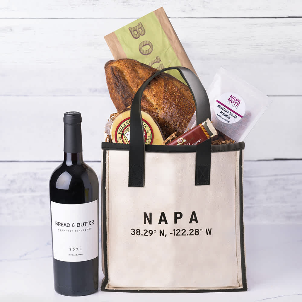 Taste of Napa Welcome Tote Taste of Napa Welcome Tote - Share the rich history of Napa and Sonoma with your friends and family, through these locally sourced goods inspired by a scenic Napa Wine Train tour. They'll be prepared for any adventure with Bread & Butter Cabernet, delicious Sourdough bread, Cheese, nuts, and a gourmet Chocolate bar. Whether they're exploring Napa or Sonoma, or you're sharing a piece of your home with them, they'll absolutely love the local touches in this gourmet gift tote. Contents: Bread & Butter Cabernet Sauvignon, Fresh Loaf of Bread, Fresh Cheese, Gourmet Chocolate, Napa Nuts, Napa Valley Tote Bag