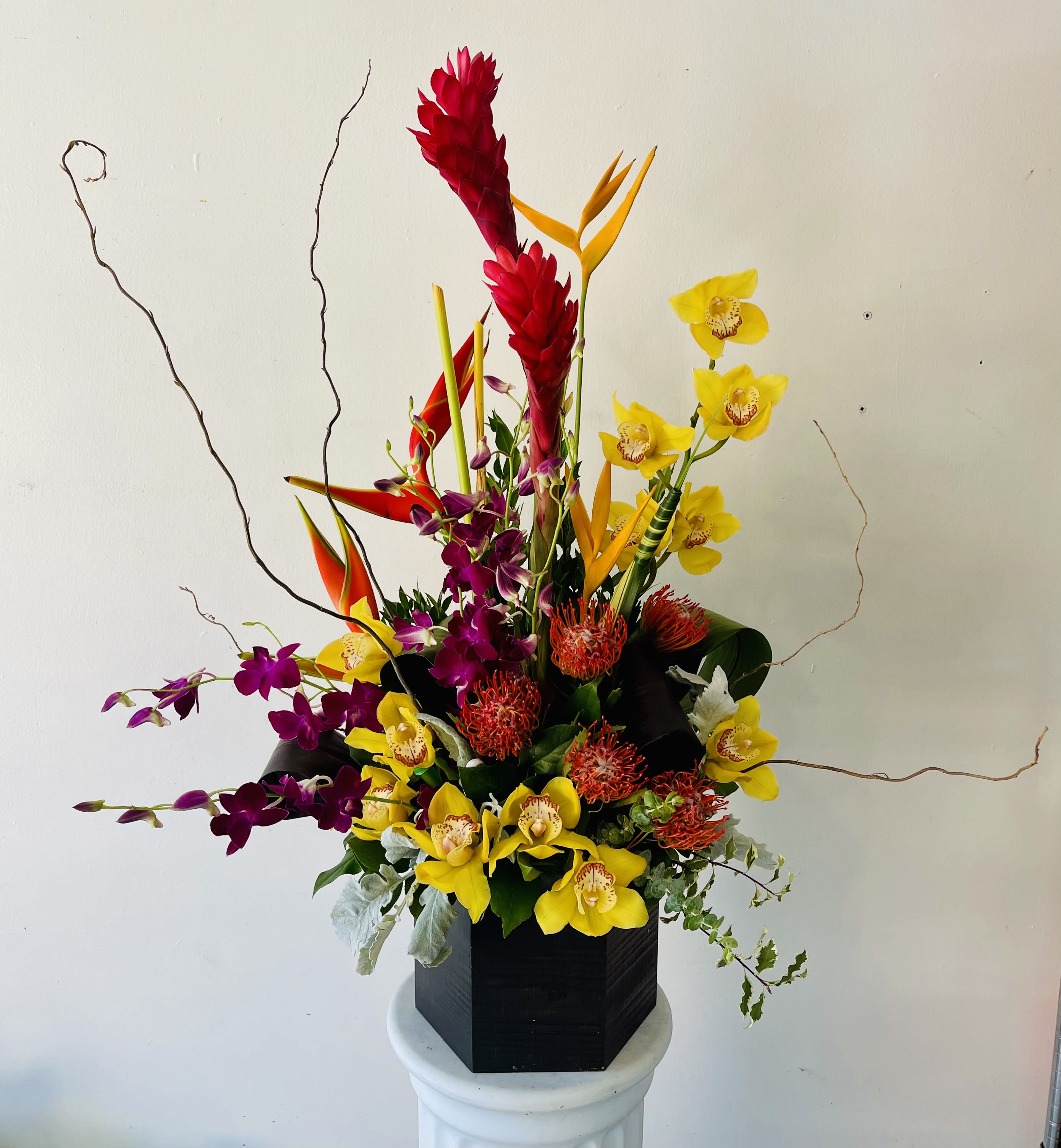 Tropical Sculpture - A stunning arrangement of tropical flowers and orchids.