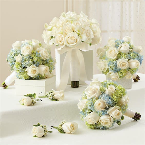 Personal Package (1 Blue Bridal Bouquet, 3 Bridesmaid Bouquets And 4 Boutonnieres. - Make your wedding day unforgettable with these vibrant, hand-designed arrangements that arrive fresh from our premier florists. This beautiful collection includes: • 1 bridal bouquet, 3 bridesmaids bouquets, 1 Groom’s boutonniere, 3 Groomsmen’s rose boutonnieres. Please specify in Special instructions if you prefer it in different colors. Please give us at last 48 hours for this package.