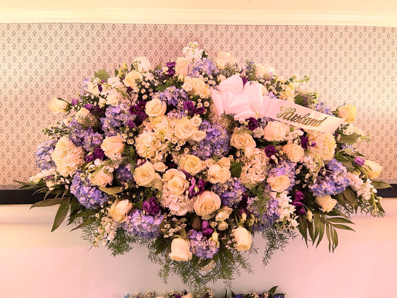 Blue Heaven Casket Spray - At a time of great loss, this soft loving tribute brings comfort and loving reflection when needed most. 