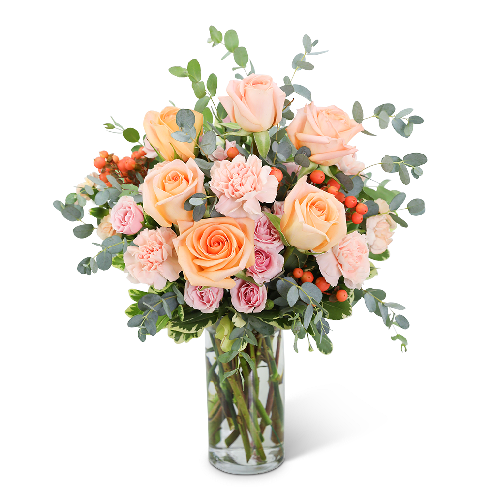Sorbet Symphony - Sorbet Symphony may look good enough to eat but it’s even more beautiful to receive and display! This floral design is a soft collection of roses, carnations, hypericum berries, and assorted foliage in a tall clear vase. As irresistible as its namesake, it’s the perfect gift for an anniversary, birthday, or any special occasion. We offer same-day flower delivery in most cases.
