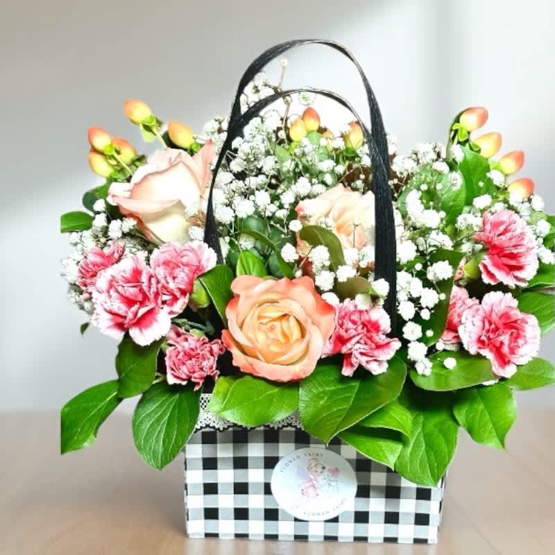 Flower Arrangement In A Bag Designer's Choice #60 - Experience the beauty of personalized floral artistry with our Designer's Choice Flower Arrangement in a Bag. Each arrangement is a unique creation, tailored to your preferences and crafted with the freshest blooms of the season. Our expert florists will contact you to discuss your preferred flower choices and color palette, ensuring that your arrangement perfectly matches your vision.  Presented in a chic, stylish bag, this arrangement is perfect for any occasion, whether it’s a birthday, anniversary, or just to brighten someone's day. Trust our designers to blend creativity and elegance, delivering a floral masterpiece that will delight and impress. Order now for a bespoke floral experience that’s as unique as you are.